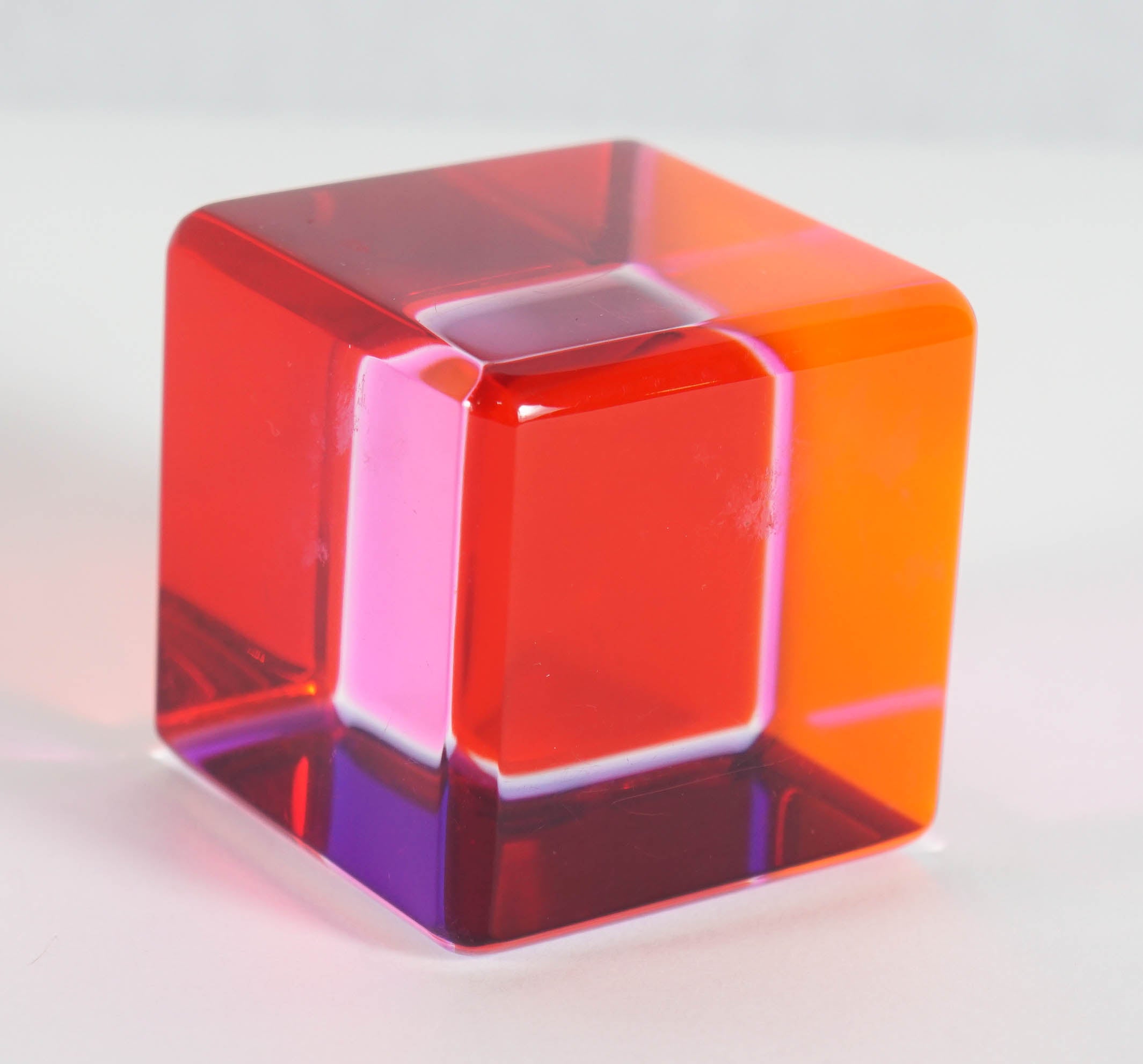 Here is a singular Vasa Mihich lucite cube in orange and pink. 