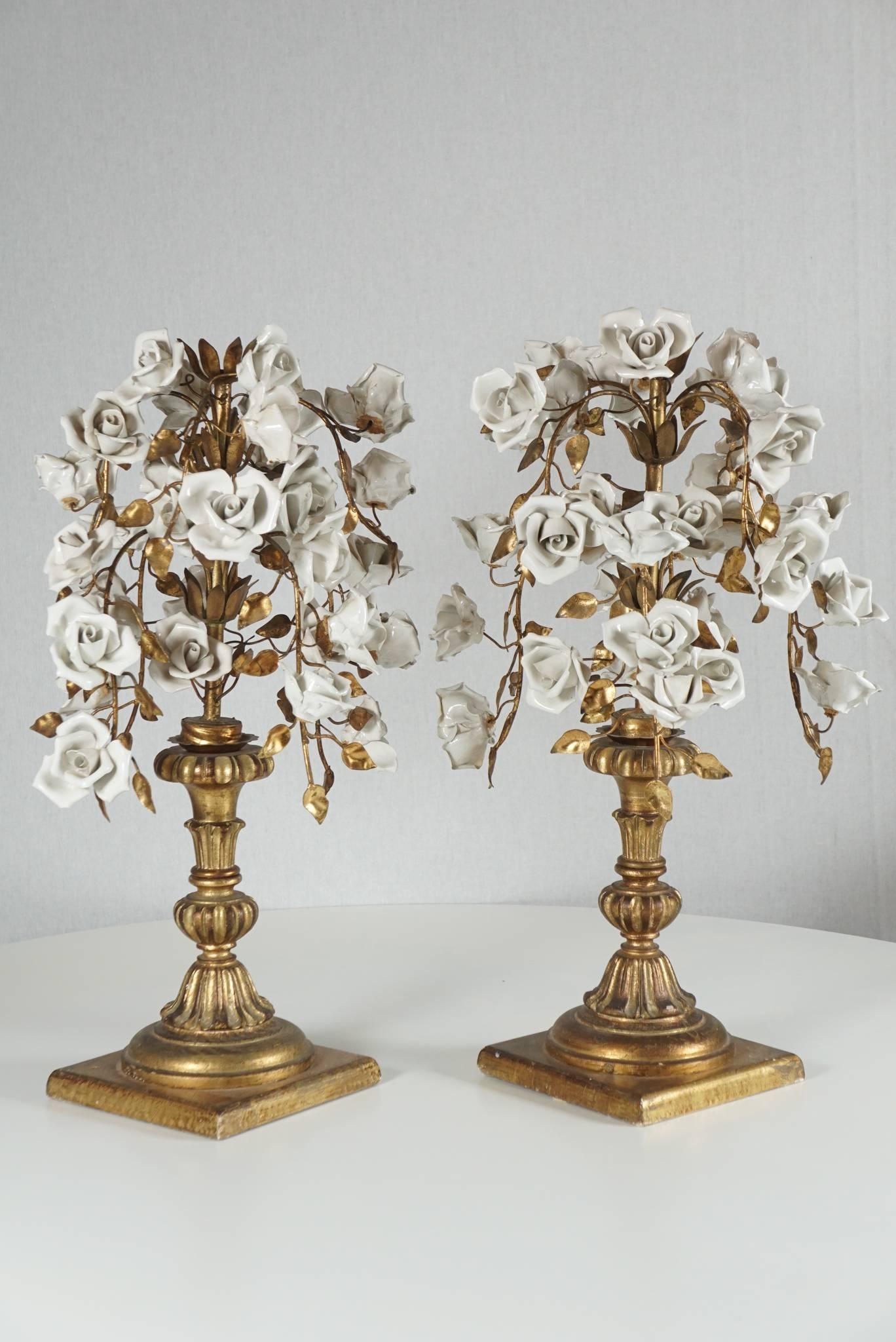Here is a pair of beautiful blanc de chine rose bouquet sculptures on giltwood pedestal bases. The bouquet consists of gold painted stems and leaves. The pieces are originally stemmed inside and can easily become lamp bases.