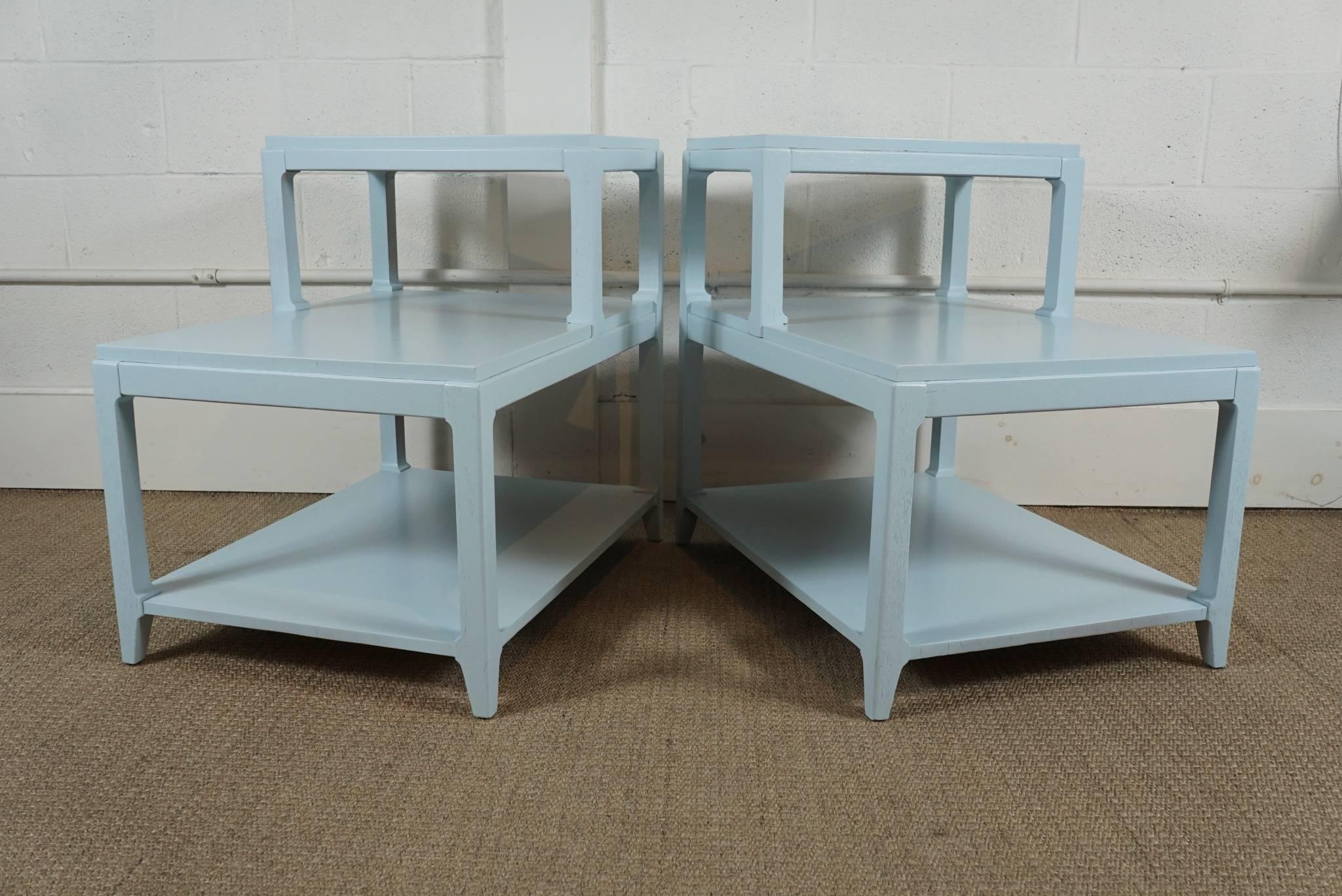 Here is a pair of modern stepped end tables that have been painted in a pale blue. The top shelf is 13 inches deep and the bottom shelf is 16 inches high.
