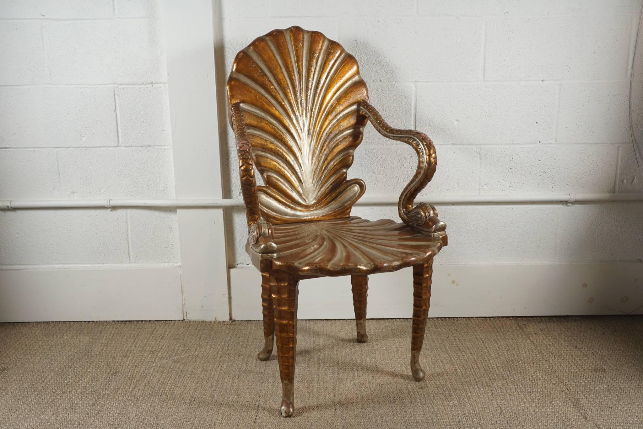 Here is a beautiful grotto shell chair in wood with a gilt and silvered finish.