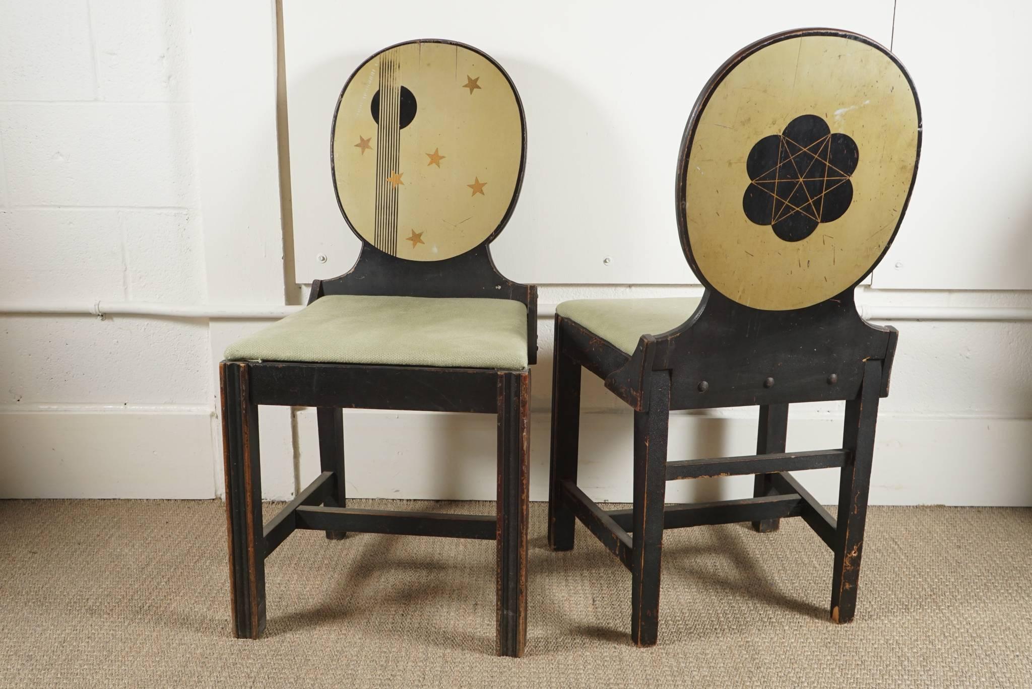 Here is a great pair of graphic painted side chairs in an Arts & Crafts style.
The chairs have painted fronts and backs with a great graphic sensibility including a polyhedron sphere. The patina has just the right amount of wear.
The chairs are