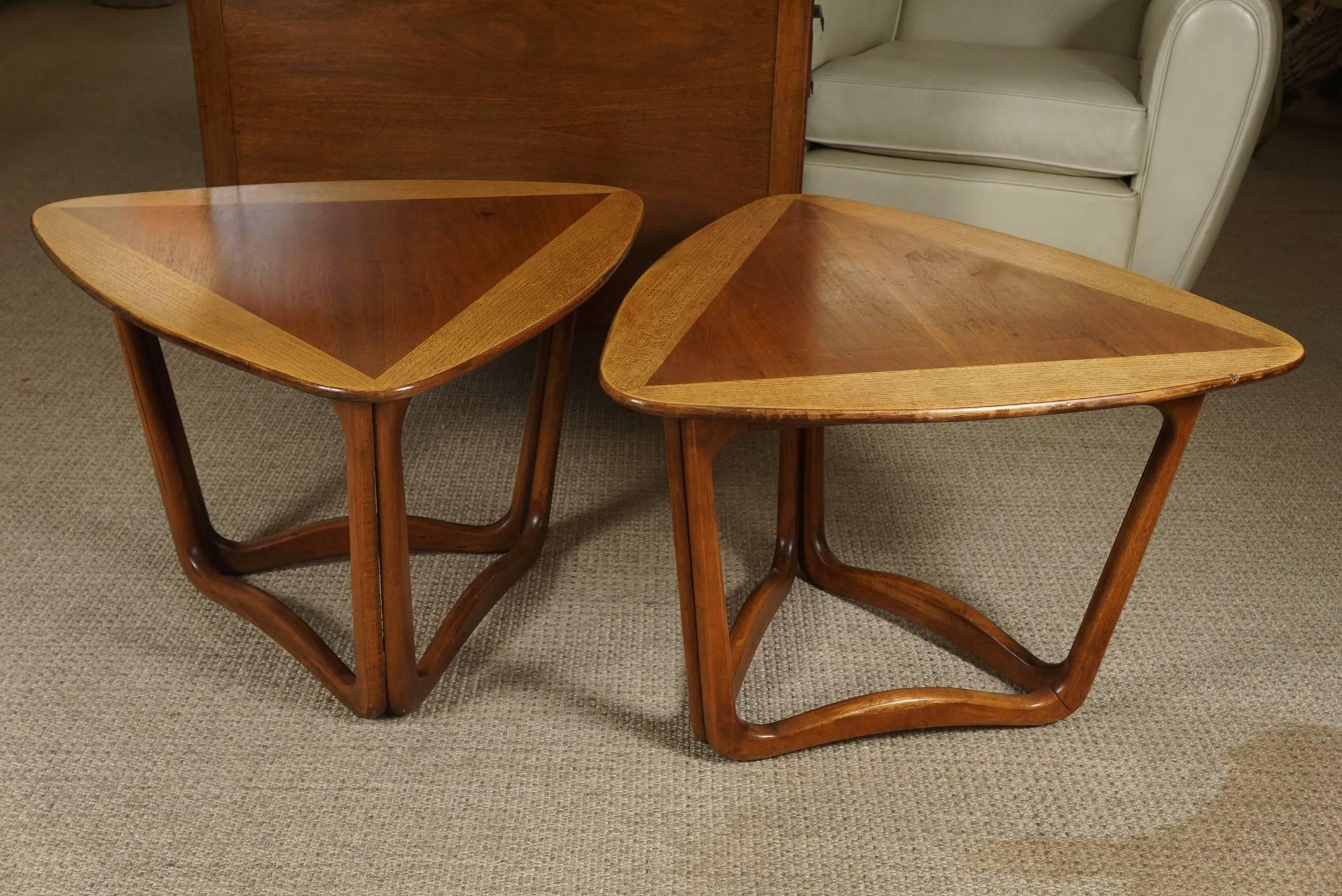 Here is a great pair of end tables with a triangular top. The two tone top makes a graphic statement that is echoed in the base.