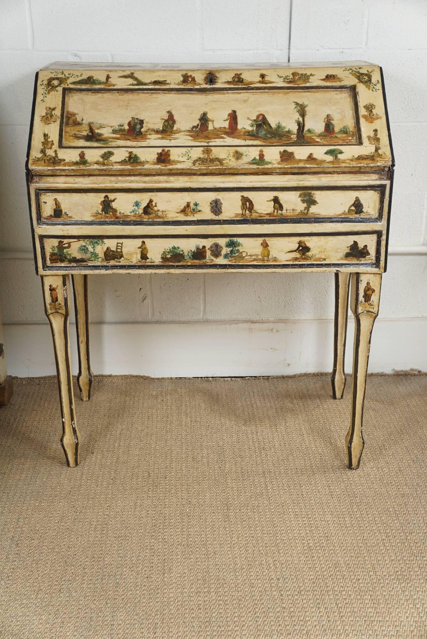 Here is a charming painted Italian desk with decoupaged figures and scenes. The desk has a drop front with link chain that has been recently added but not shown.