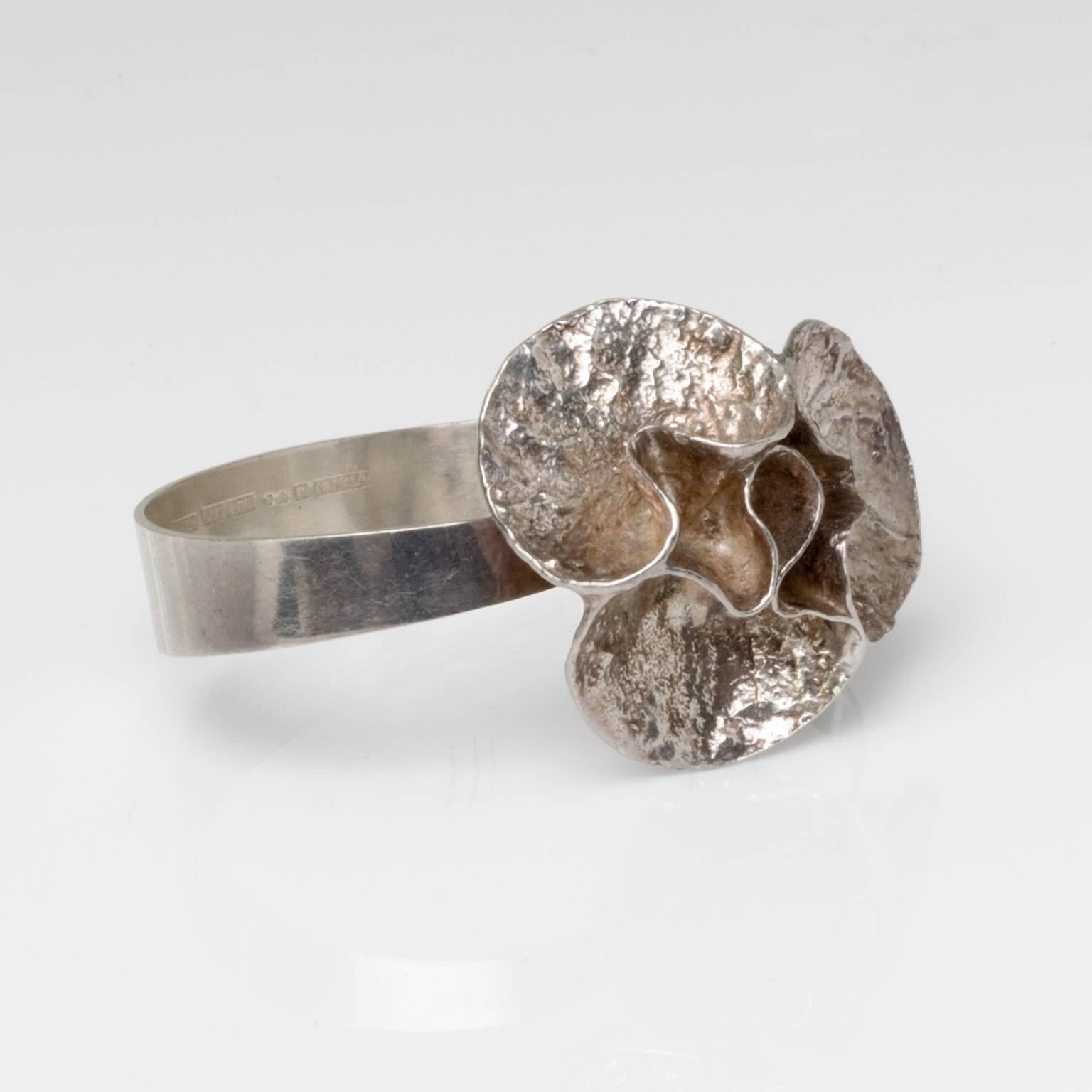 Silver bracelet with acid treated surface by Theresia Hvorslev and stamped 'Mema', Lidkoping, Sweden, 1976.
Measures: Depth: 2.75