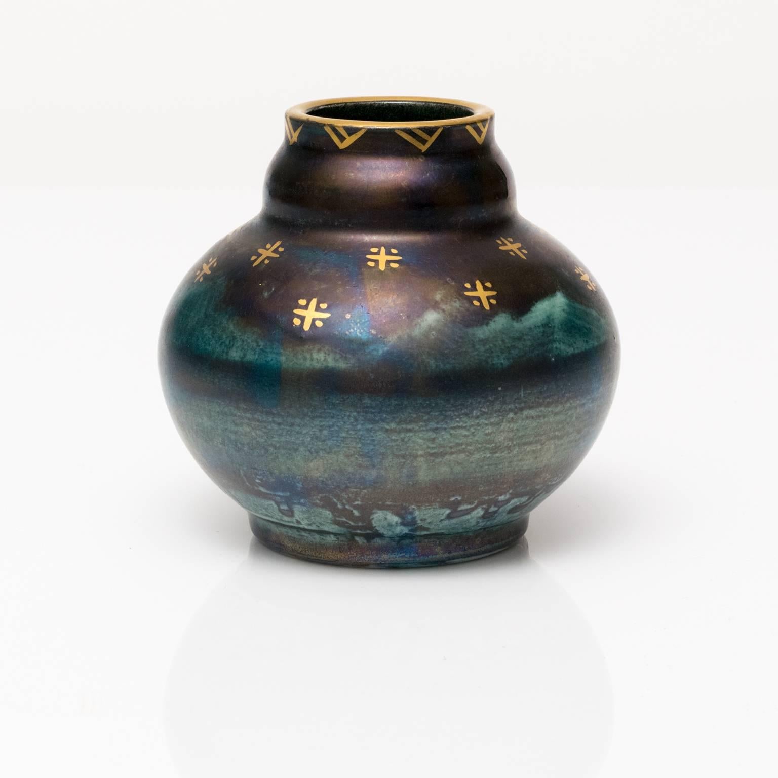 A small Scandinavian Modern, Art Deco ceramic vase with blue luster detailed in gold. Designed by Josef Ekberg for Gustavsberg, signed and dated 1928.
 
Measures: Height 3.5", diameter 4".

 