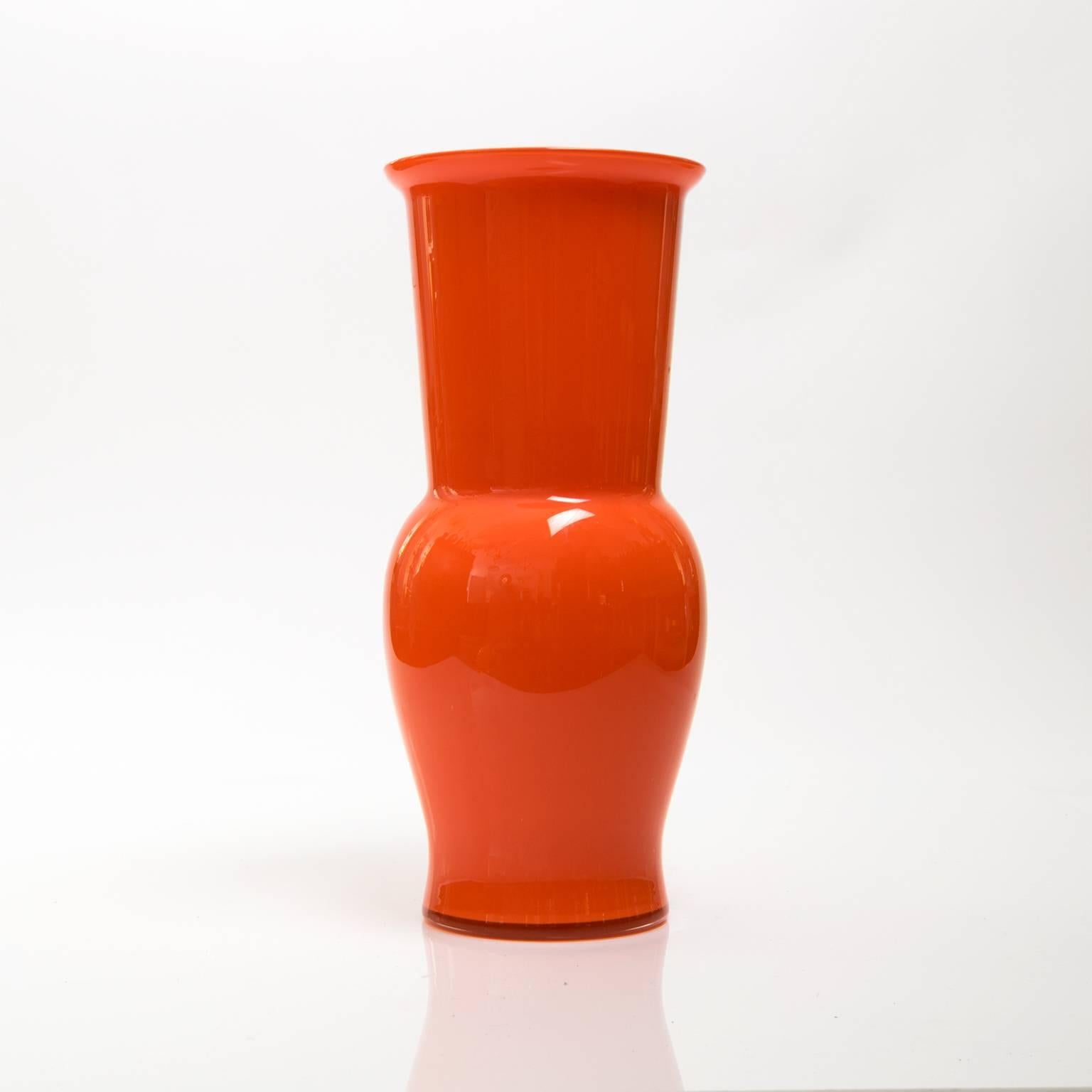 Scandinavian Modern Large red-orange cased glass vase from Denmark, circa 1960s.
 
Measures: Height 13.5", diameter 6".