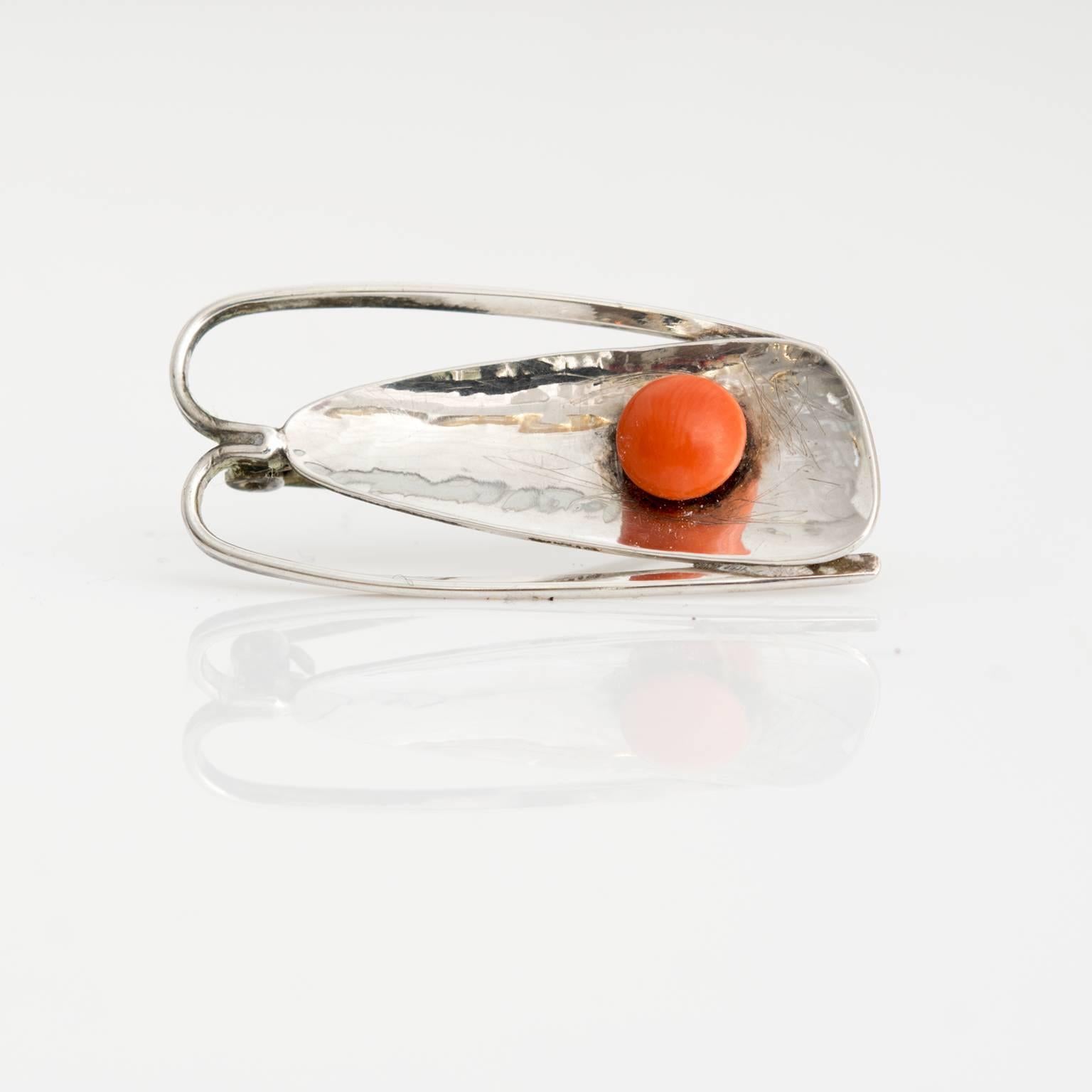 Silver Bauhaus brooch with coral detail, by Hein Meyer, Bremen, Germany, circa 1930s.
Measures: Length: 1.75