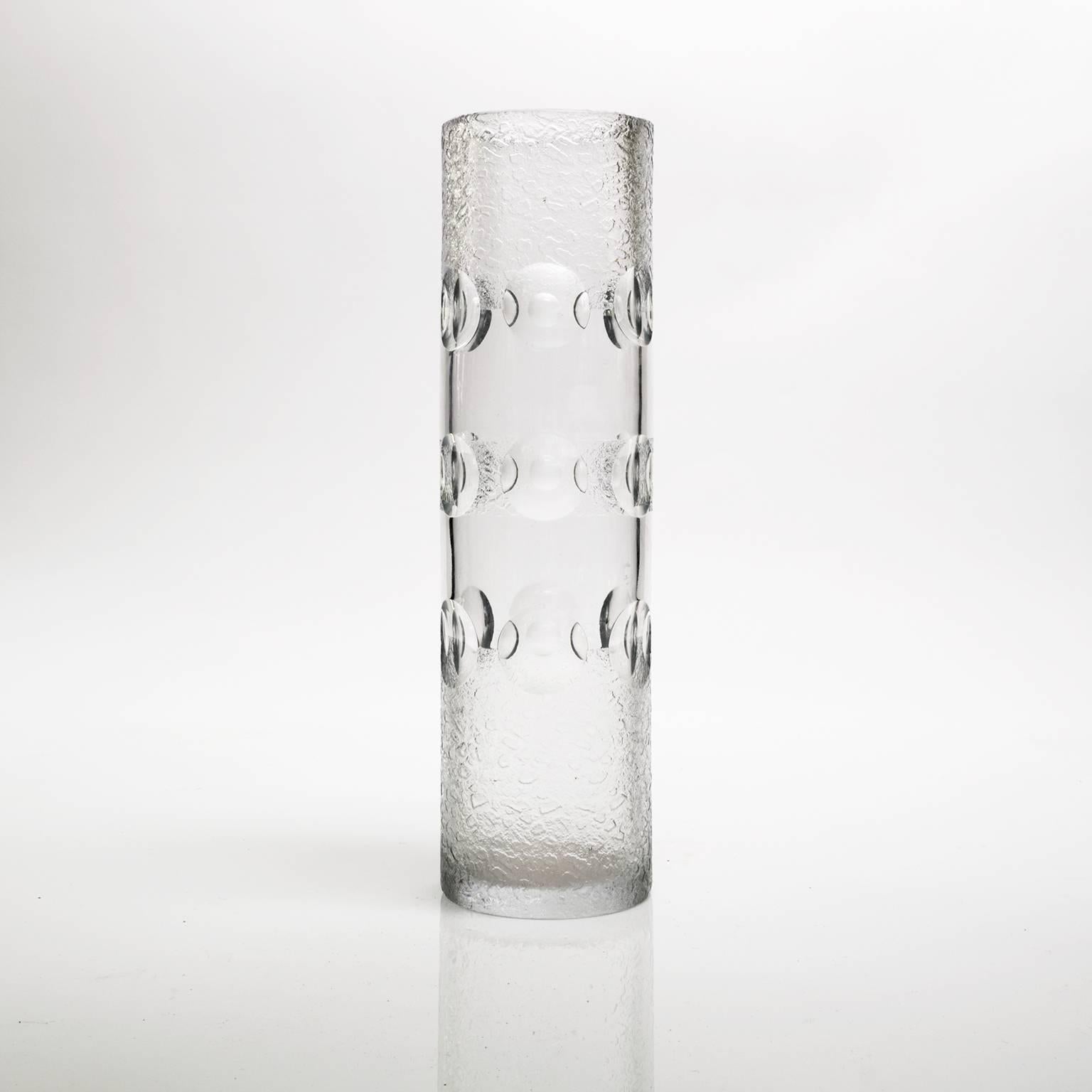 A tall modernist 1970s lead crystal vase with a pattern of concave circles and etched textured bands at the top and bottom.
 
Measures: Height 14.25