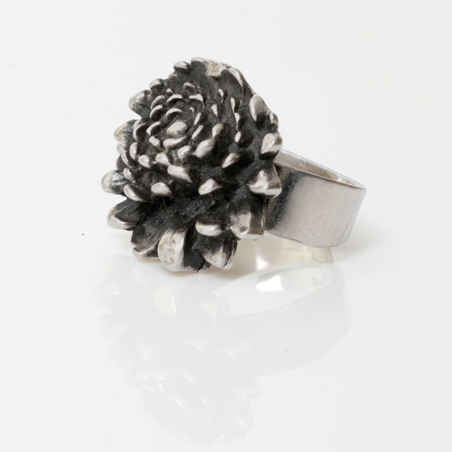 A Scandinavian Modern, Finnish silver ring in the form of a flower by Pentti Sarpaneva, for Åbo, 1972.
Diameter: 1"
Height: .75"