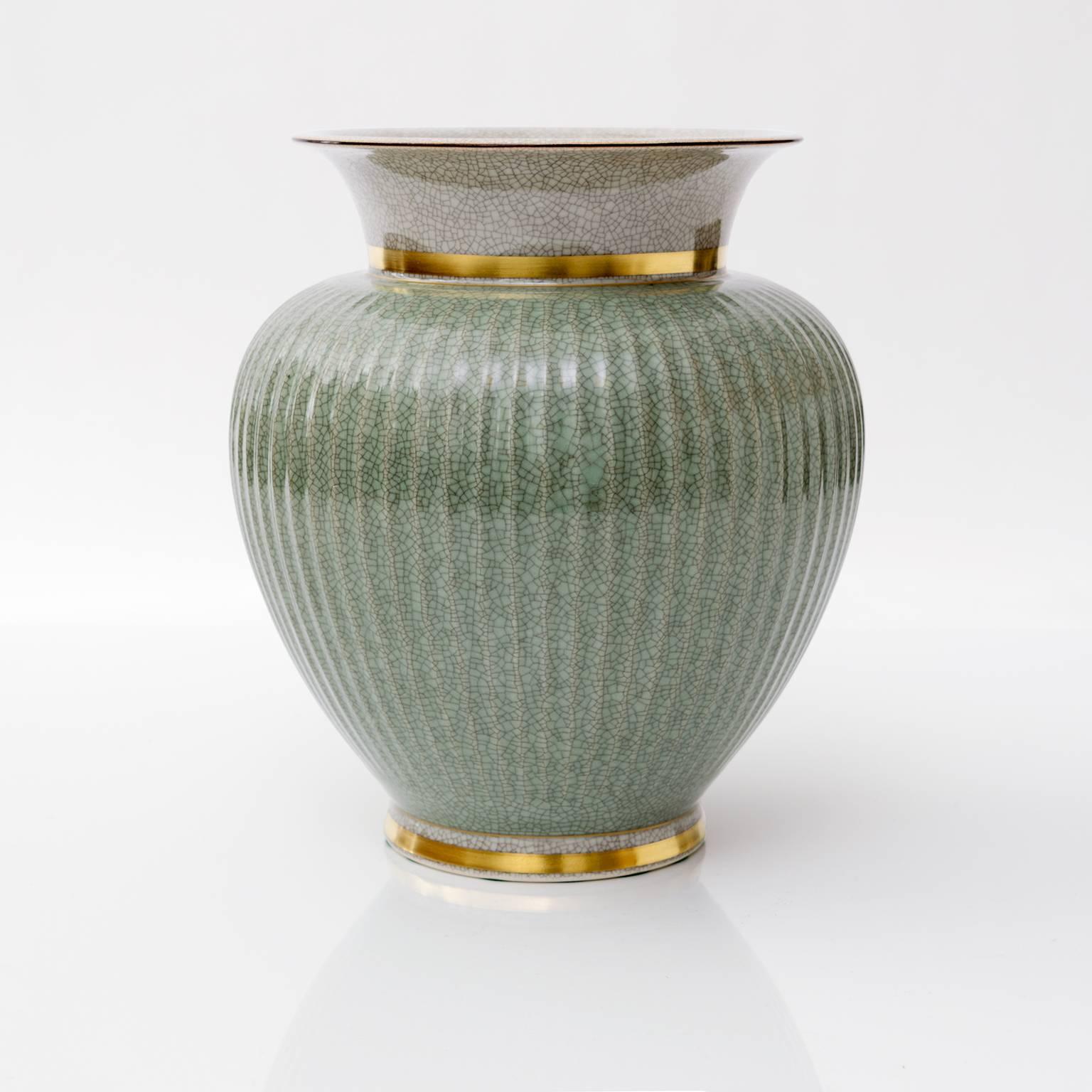 Scandinavian Modern, large Royal Copenhagen ceramic vase in green and white (craquelure) crackle glaze and detailed in gold. Made in Denmark, circa 1940s. Measures: Height 9.75