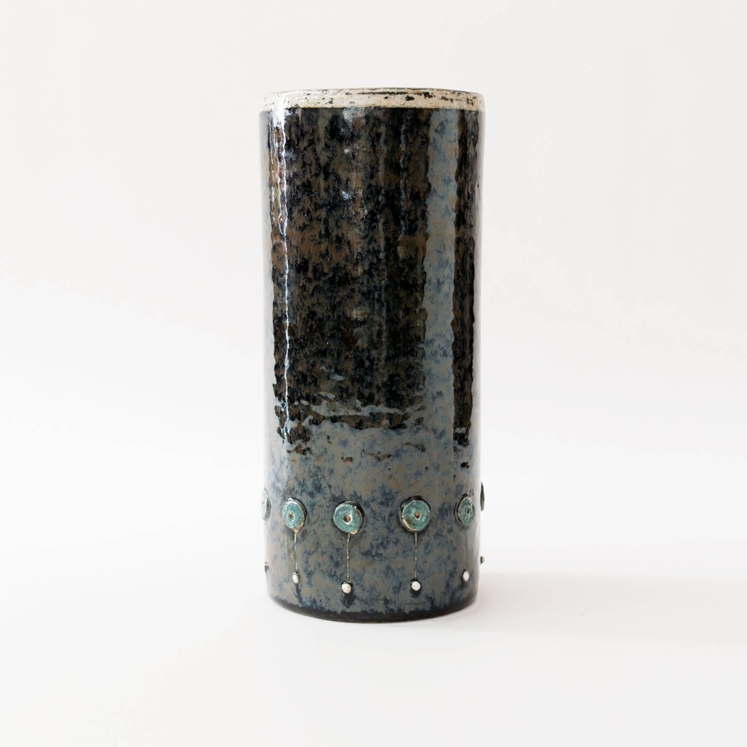 A tall Scandinavian modern Mid-Century ceramic studio vase with raised elements and finished in a dark glaze by designer Sylvia Leuchovius for Rorstrand, Sweden.
 
Measures: H 10", D 4.5".
