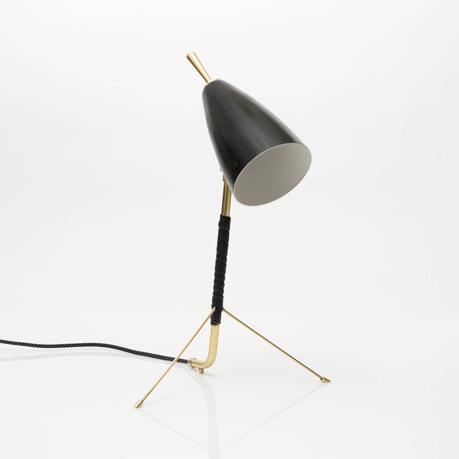Scandinavian modern small desk lamp made with polished brass, black lacquered metal and a leather wrapped stem. Newly rewired with one candelabra base socket.
 
Measures: Height 13.5“, depth 8”.