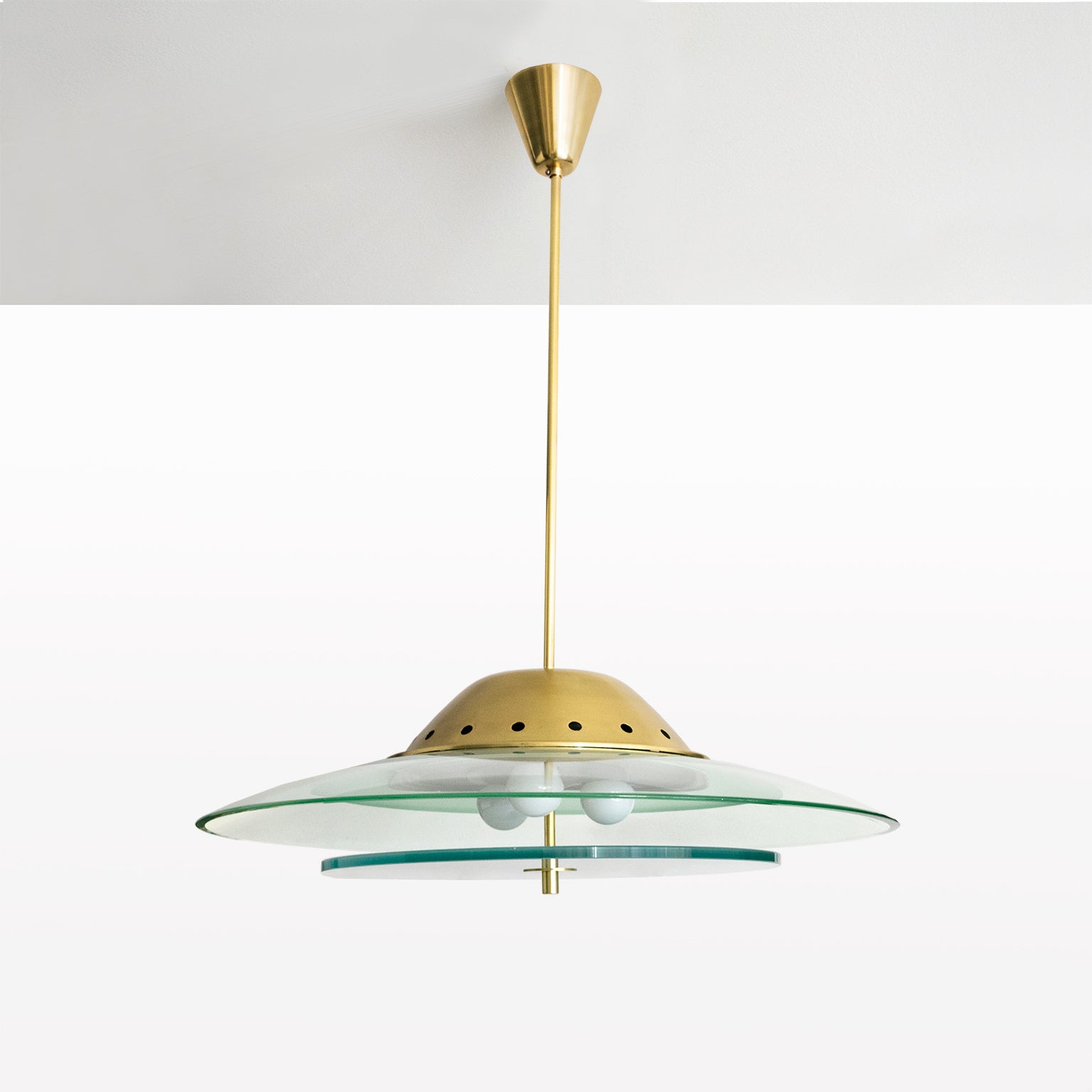 A sleek modernist glass and brass pendant fixture by the brilliant Pietro Chiesa for Fontana Arte, Milano, Italy, circa 1950. Newly rewired with standard base sockets detail with porcelain rings. Newly polished brass and original painted metal