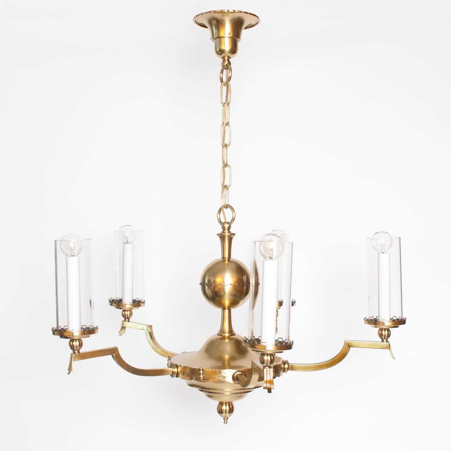 Polished Scandinavian Modern Five-Arm Brass Chandelier with Cylindrical Glass Shades For Sale