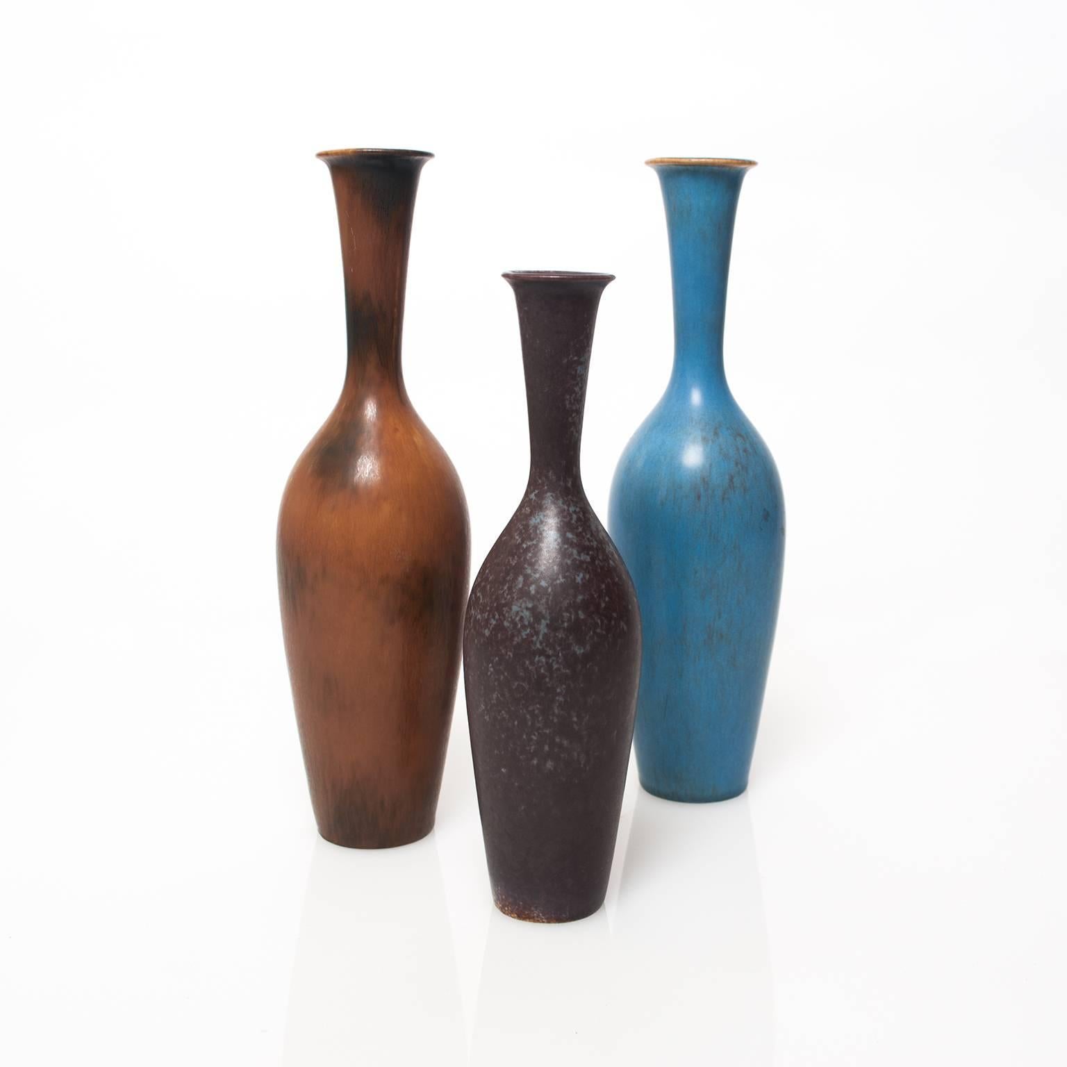 Group of 3 elegant Scandinavian Modern ceramic vase in blue, plum and amber glazes by Gunnar Nylund for Rorstrand, Sweden circa 1950
Height: 11.25