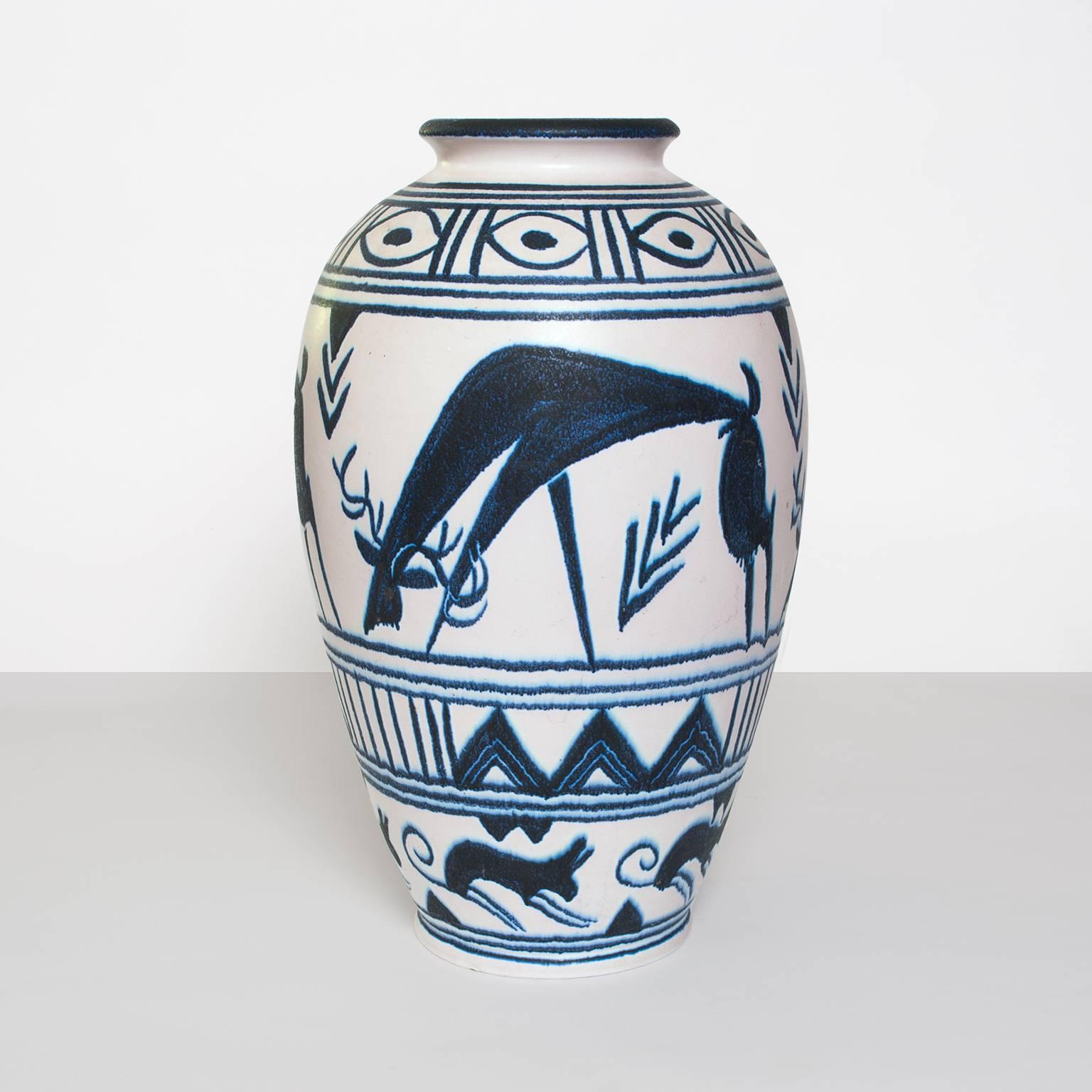 A large scale, hand decorated vase by Danish artist Mette Doller for the Swedish company Andersson & Johansson - Höganäs Ceramic, circa 1950's. The vase depicts grazing deer and geometric patterns. Vases are not drilled but could be converted to