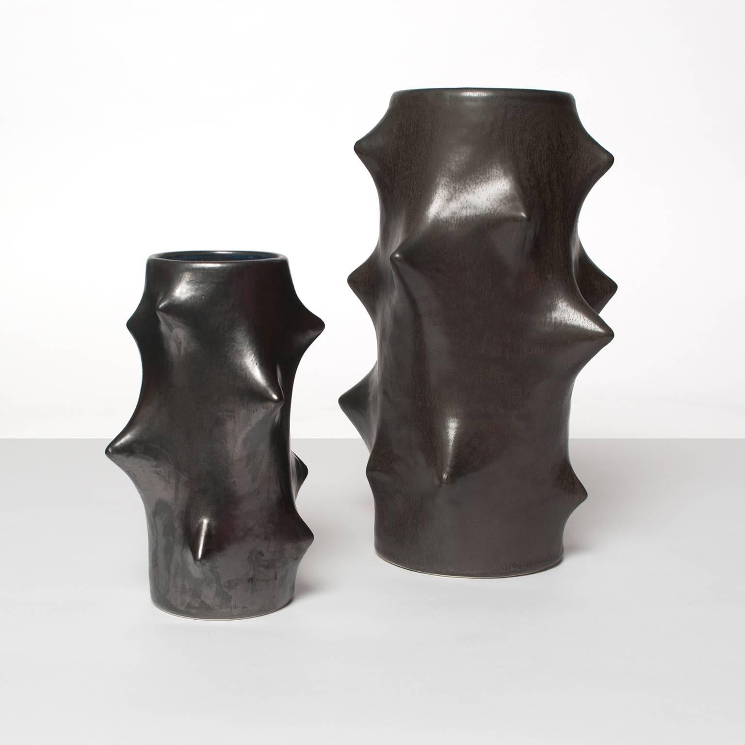One large and one smaller Scandinavian modern ceramic vases by Knud Basse for Michael Andersen & Sons. These 