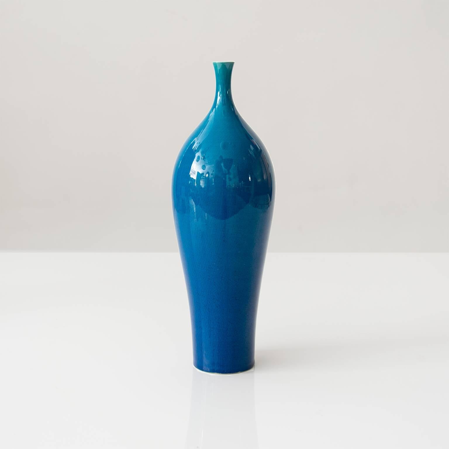 Scandinavian Modern Blue glazed vase by Swedish ceramicist Carl-Harry Stålhane, from Rörstrand. Signed on the bottom "CHS." 

Measures: Diameter 2.75, height 9".