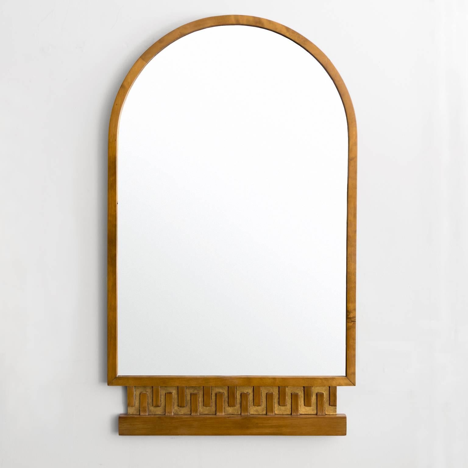 Scandinavian Modern stained elmwood mirror with an arched top and a pedestal shaped bottom decorated with a giltwood Meander pattern. Newly restored, minor wear to original glass.
Measures: Height: 36.5", Width: 21.5", Depth: 1".