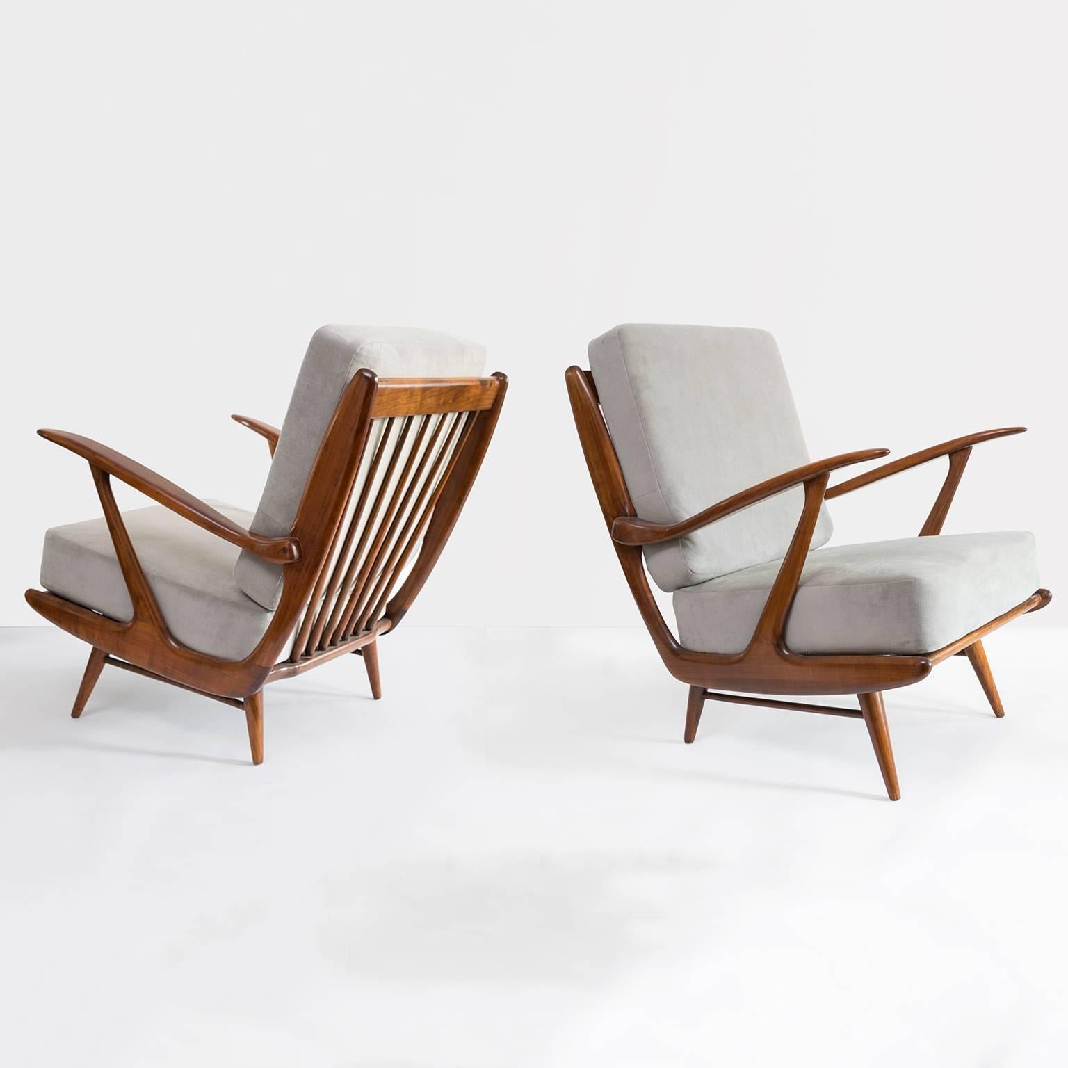Dutch Mid-Century Modern lounge chairs carved and stained fruitwood armchairs. Chairs have newly restored frames and light gray velvet upholstered cushions. Made by B. Spuij's, Holland, 1950s.