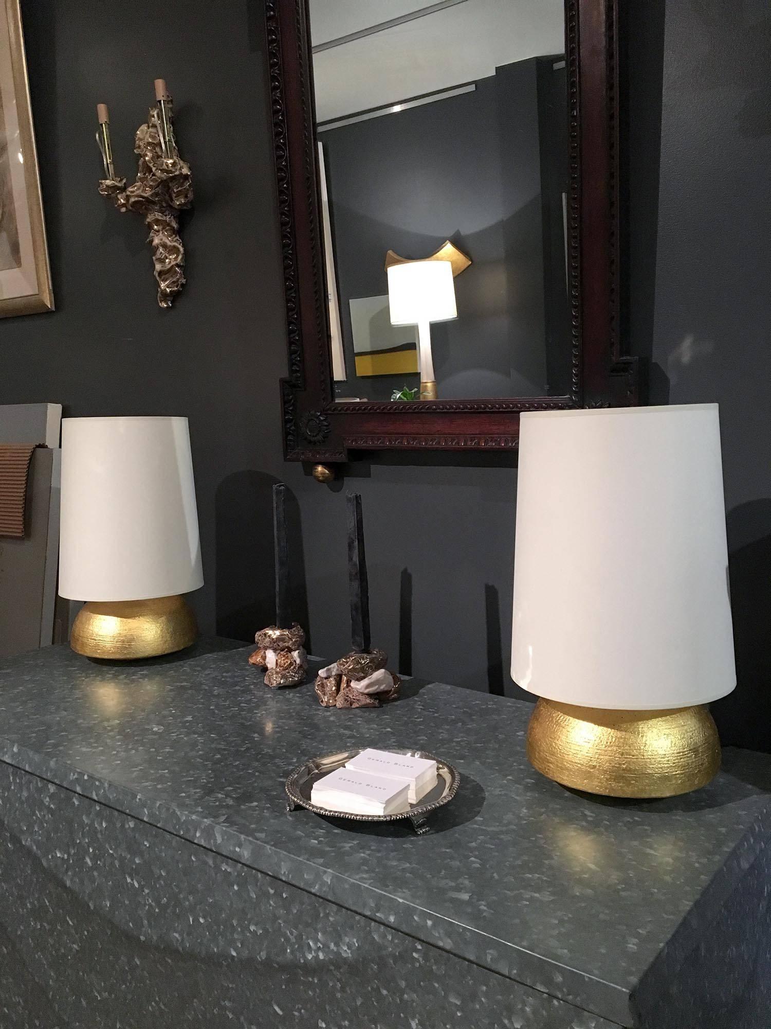 Pair of hand-coiled and gilded ceramic lamps with lampshades by Andrea Koeppel. Available as custom order.

Materials and techniques notes: Models of understated luxury, Koeppels gilt lamps are made in the hand-coiled tradition and fired with