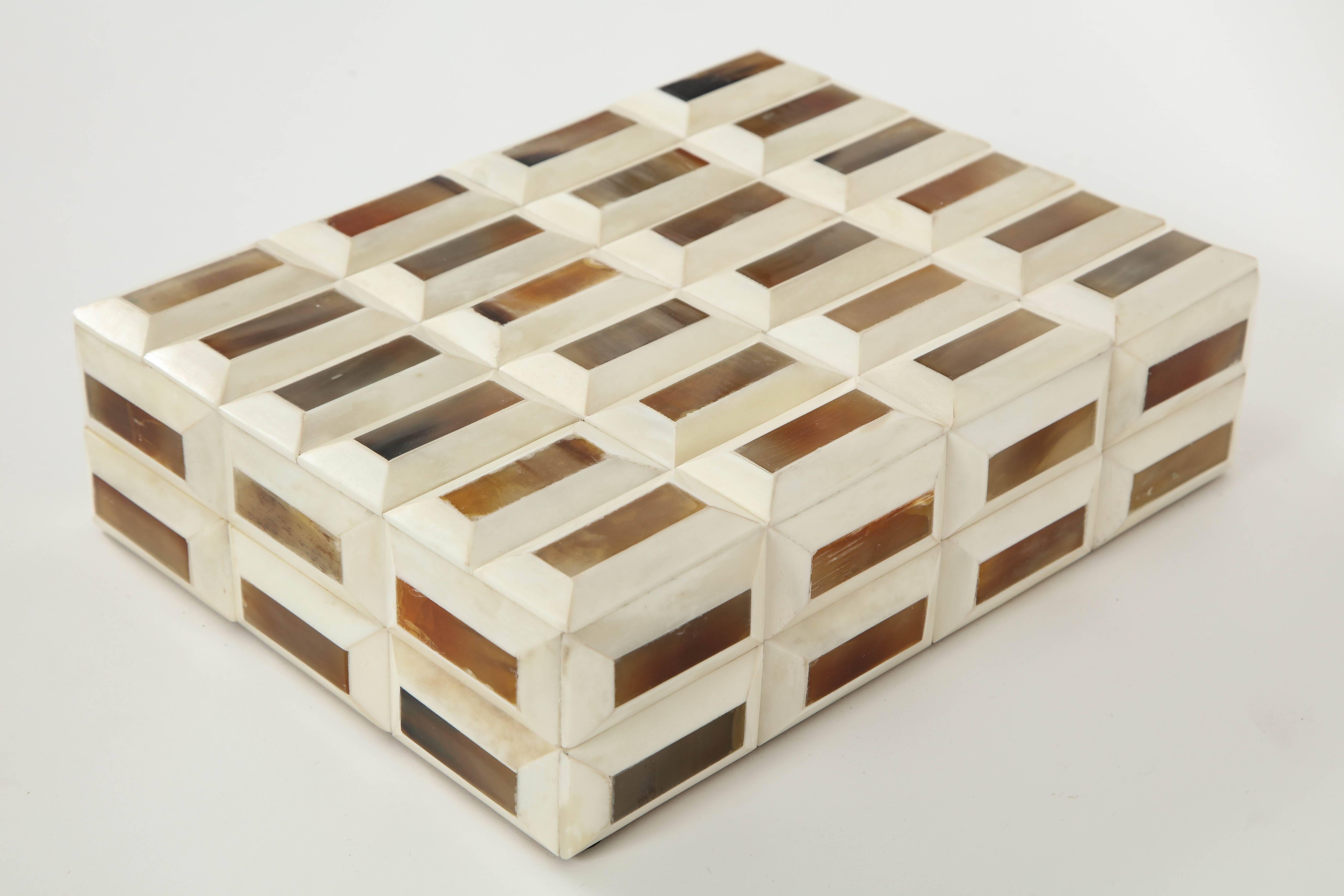 Contemporary keepsake box with faceted bone rectangle shaped elements with natural horn inlay, lined in zebrawood.