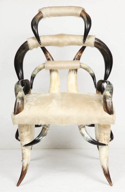 Highly sculptural side chair composed of American steer horn with new white calfskin upholstery.