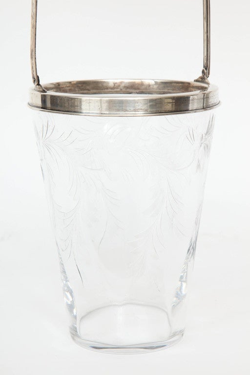 Fantastic wheel etched crystal ice pail with a sterling silver rim and handle by
T. G. Hawkes.