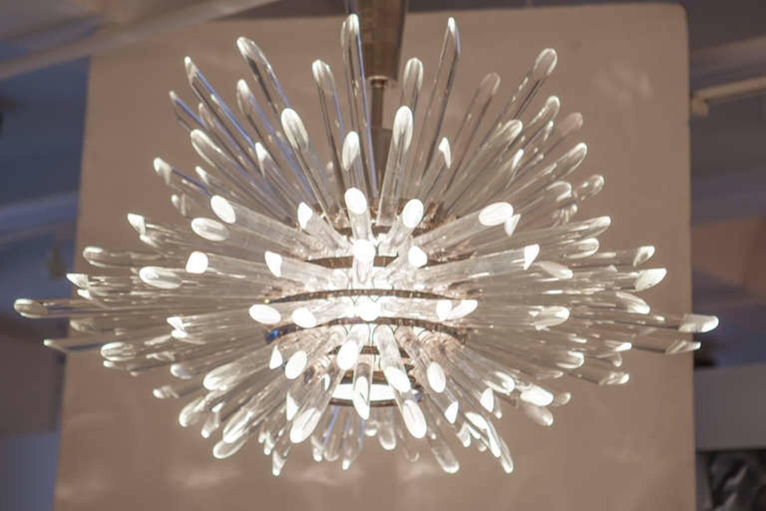 Modernist large breathtaking crystal Sputnik chandelier made from seven layers of glass rods with beveled tips on a polished nickel stem with canopy. Measures: Crystal body is 24 inches tall.