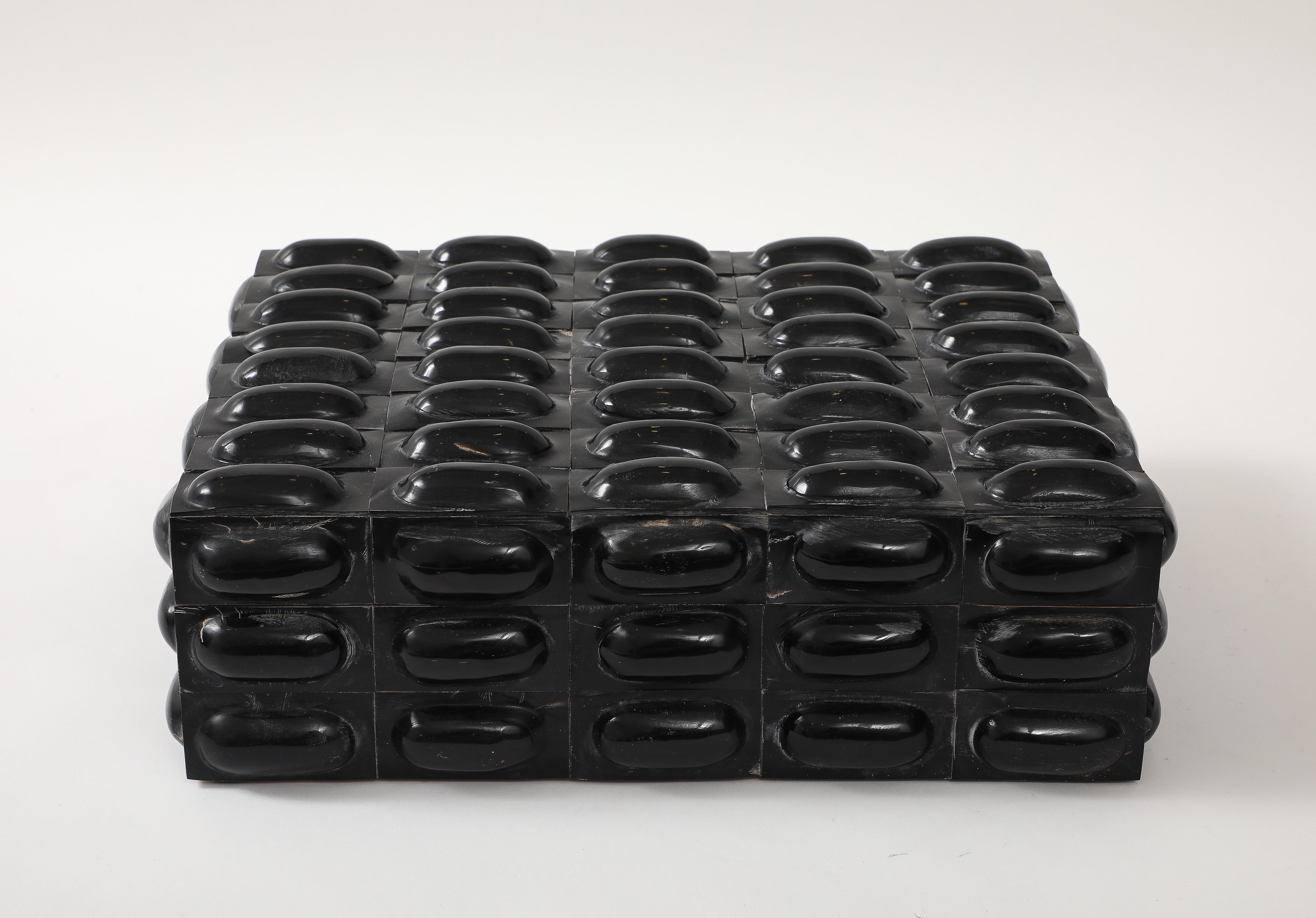 Eyecatching textural large scale keepsake, document box clad in heat set black buffalo tiles which feature a raised oval center.