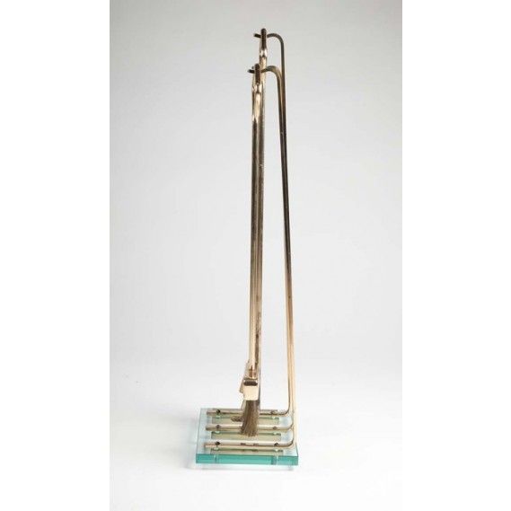 Modernist set of polished brass fireplace tools on a thick glass platform which supports the brass Stand, in the style of Fontana Arte.