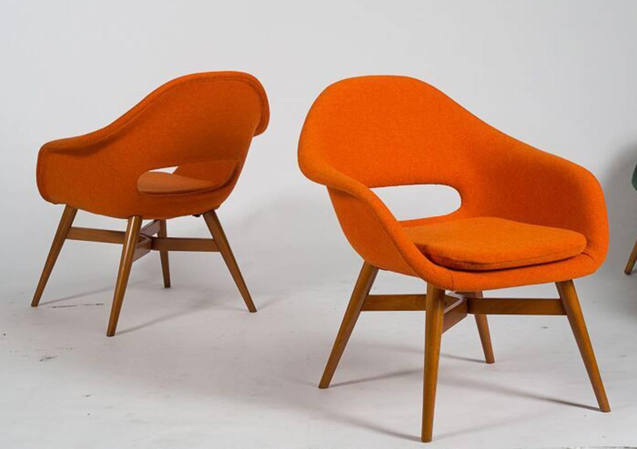 A pair of chairs designed by Miroslav Navratil manufactured in Czech Republic by "Cesky Nabytek" in 1960s. Beech plywood structure, fiberglass shell, newly upholstered in Kvadrat fabric.