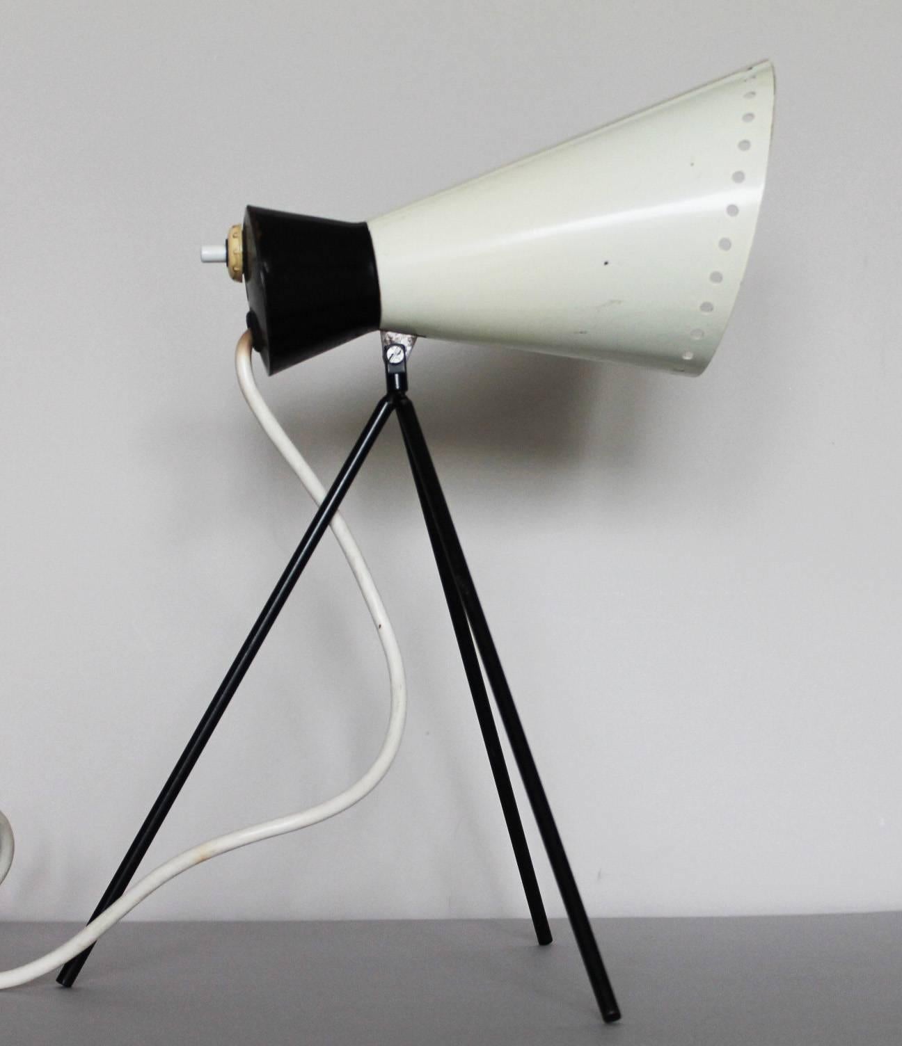 Small tripod table lamp designed by Josef Hurka for Napako. Model 1618.
Black metal tripod structure. Black and white adjustable perforated metal shade.