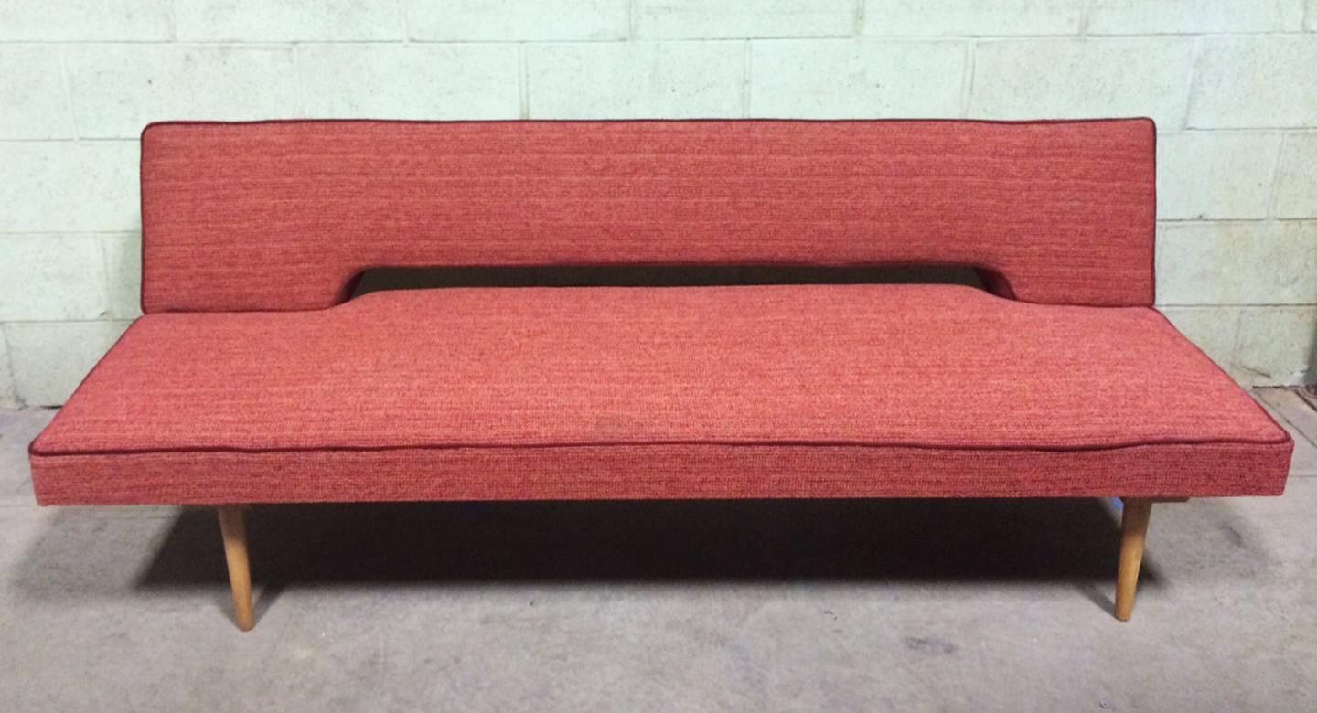 Design in 1960s an adjustable, vintage bench, easy unfolds into a bed. Newly upholstered and restored. When made into a bed it is 33