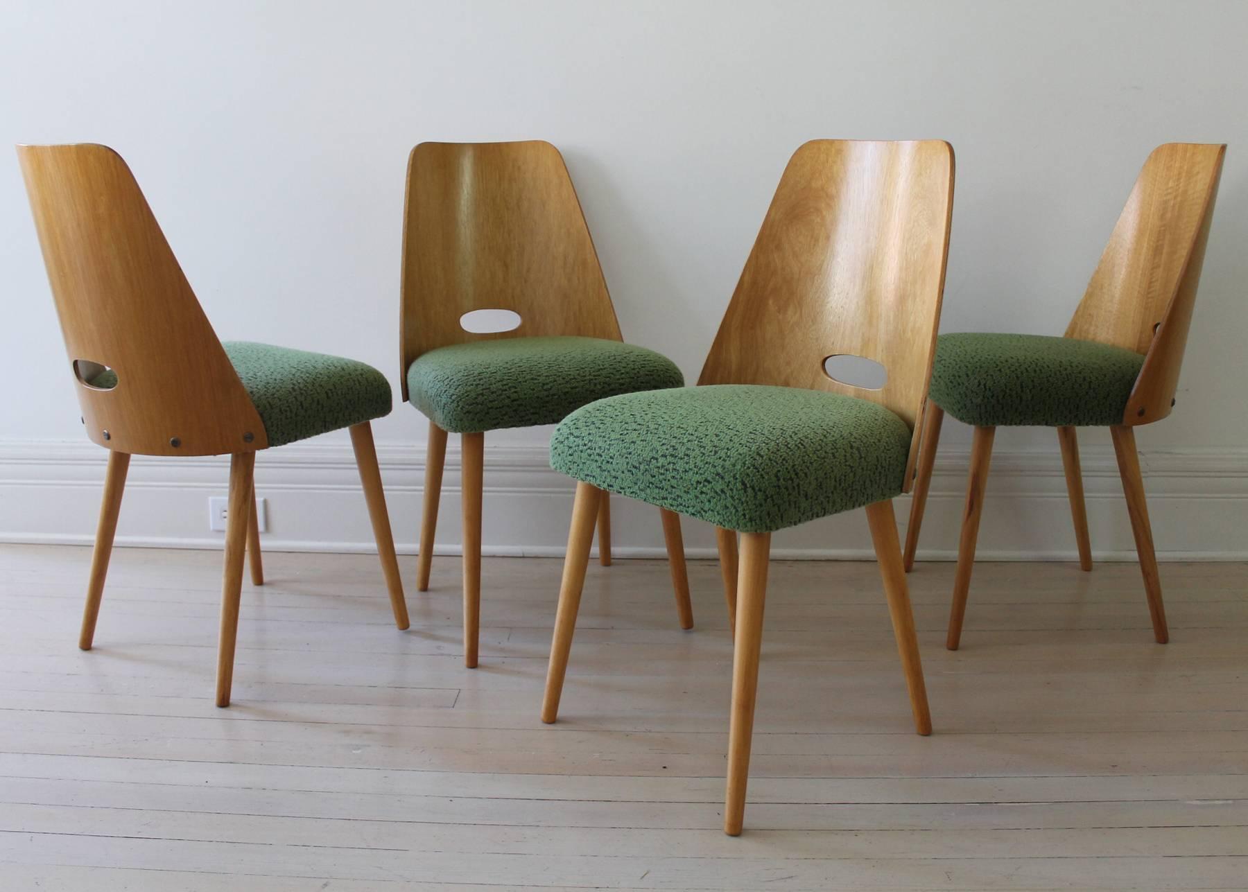 A set of four dining chairs from 1960s produced by TON in Czech Republic.
Made from linden wood, restored and upholstered with original fabric from the period.
