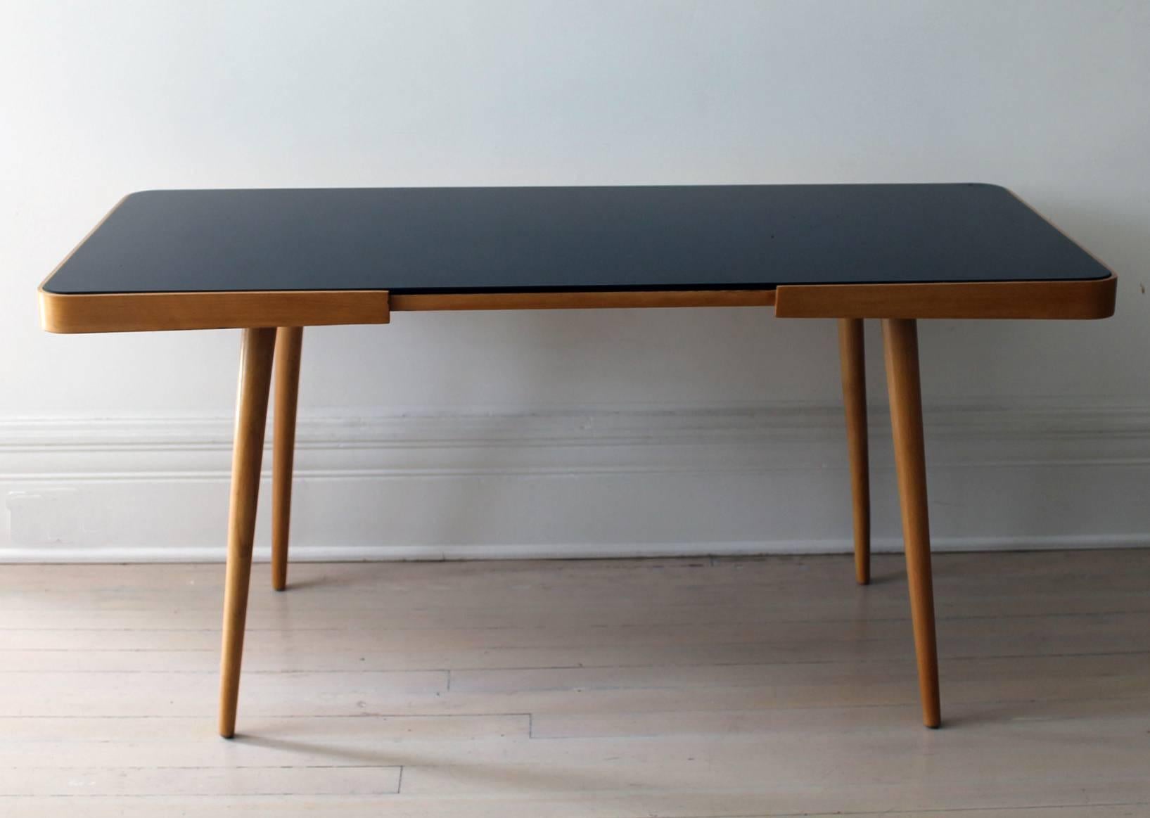 Beechwood, black glass top side or coffee table, manufactured by Cesky Nabytek in 1960s.