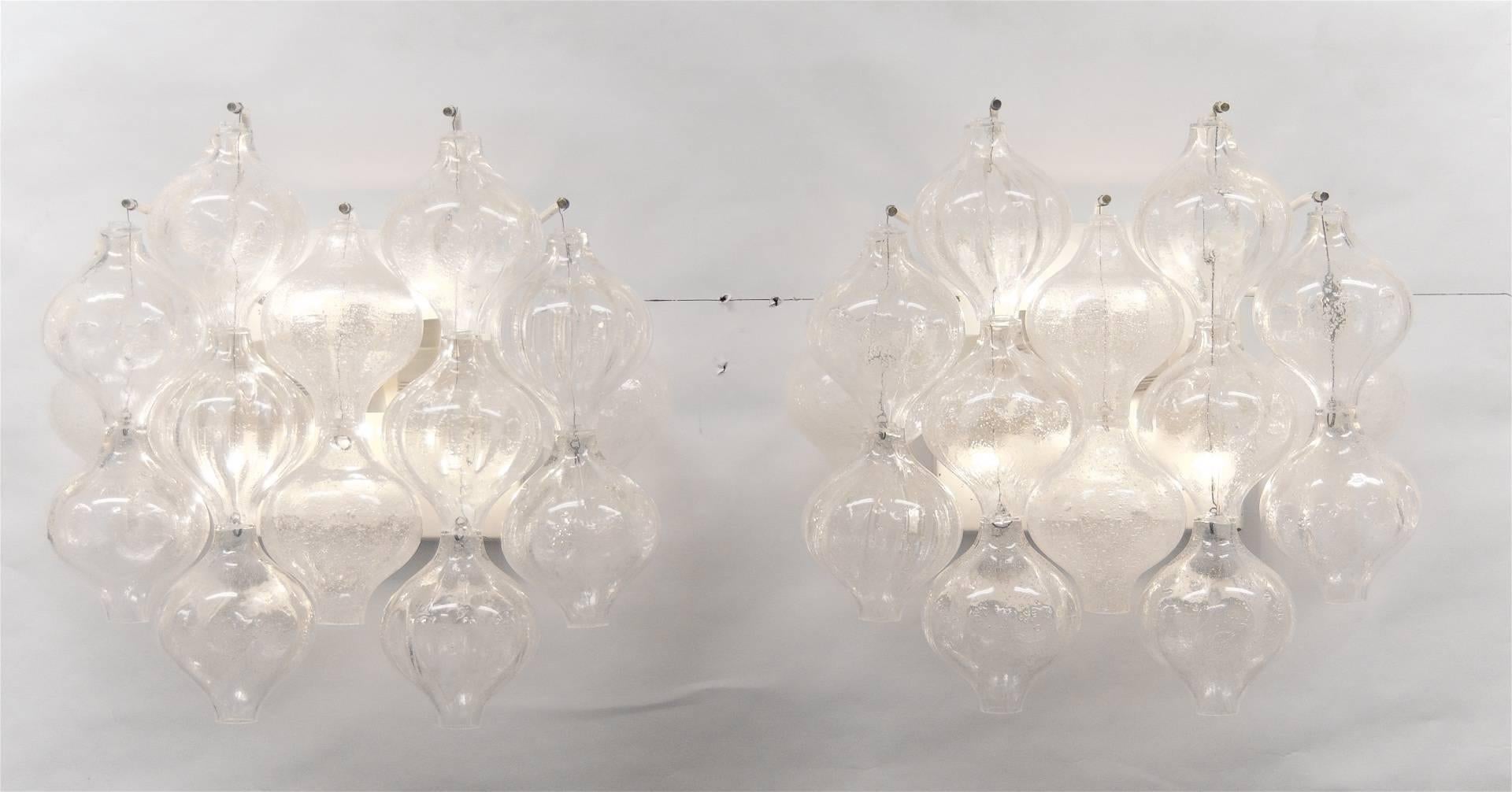 Pair of substantially sized Kalmar Tulipan sconces and each having 14 pieces of glass suspended from brass pins.

Takes five E14 base bulbs per sconce and new wiring.