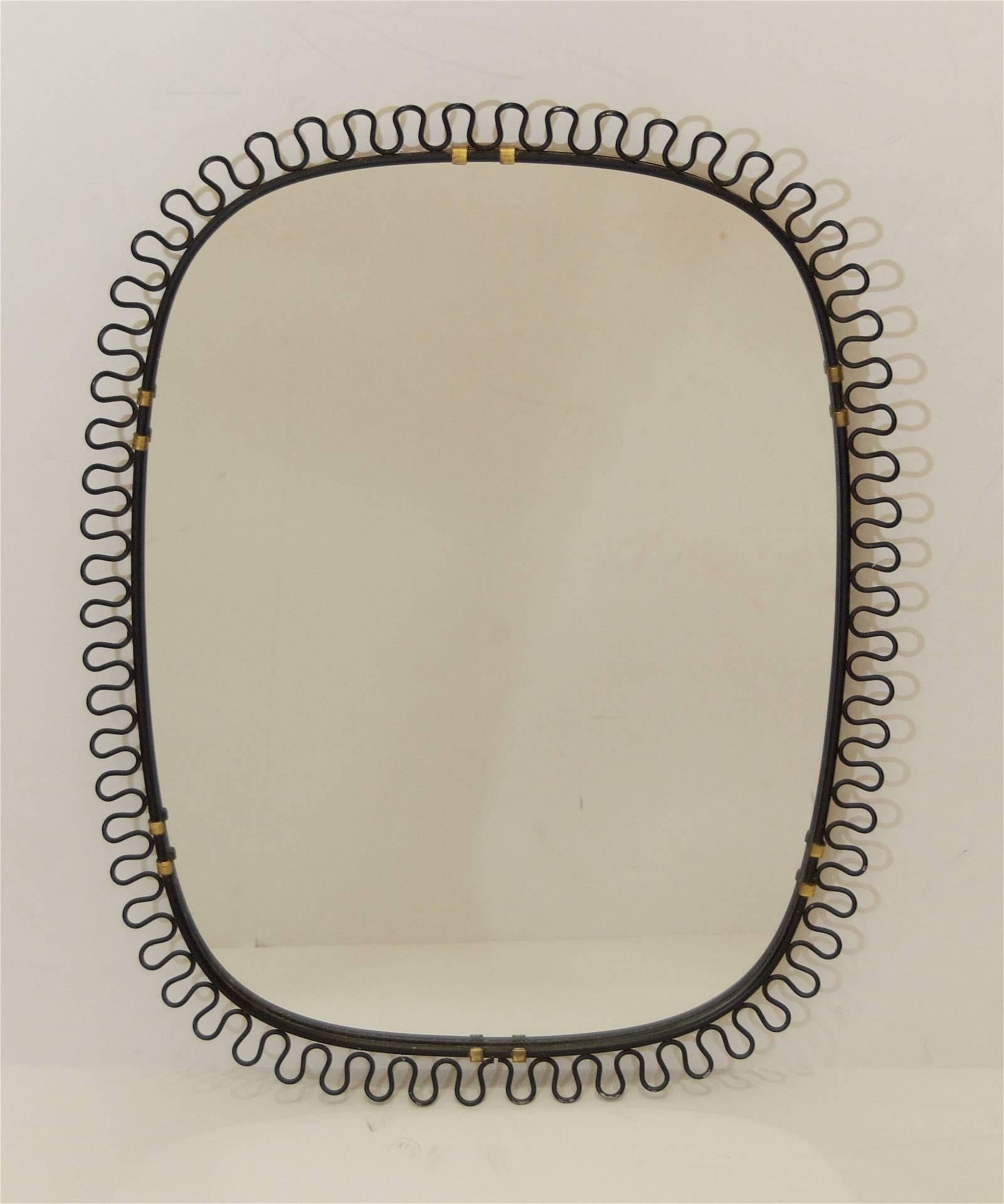 Well-shaped mirror in the style of Josef Frank, the black enameled frame with brass accents. Could also be used as a tray or plateau.