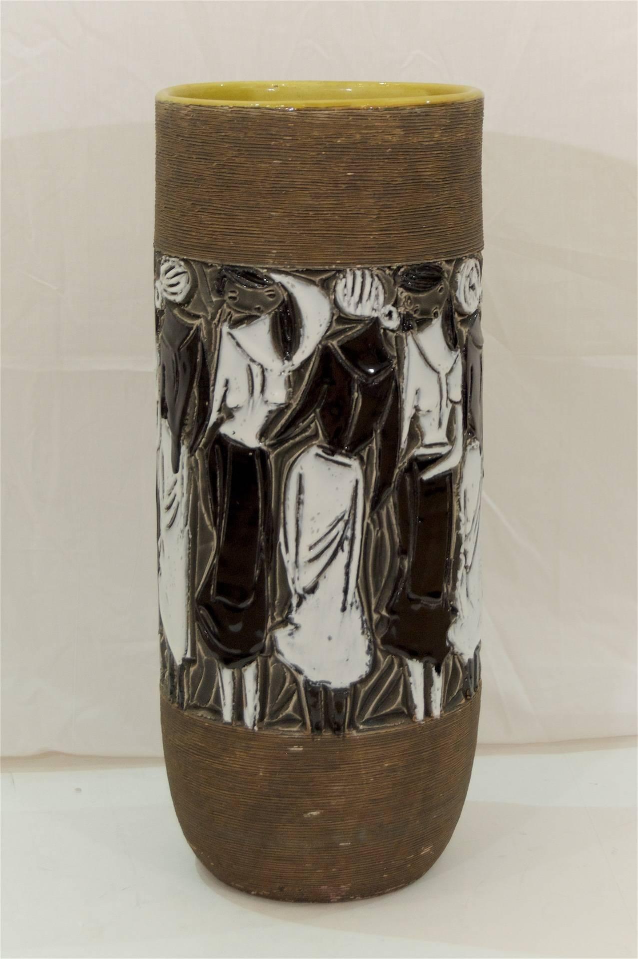 Rare and large vase by Fratelli Fanciullacci, the body with striated earth tone textural bands framing a vignette of black and white glazed women wrapping the body of the vase, with interior in chartreuse glaze.

Excellent size for use either as a