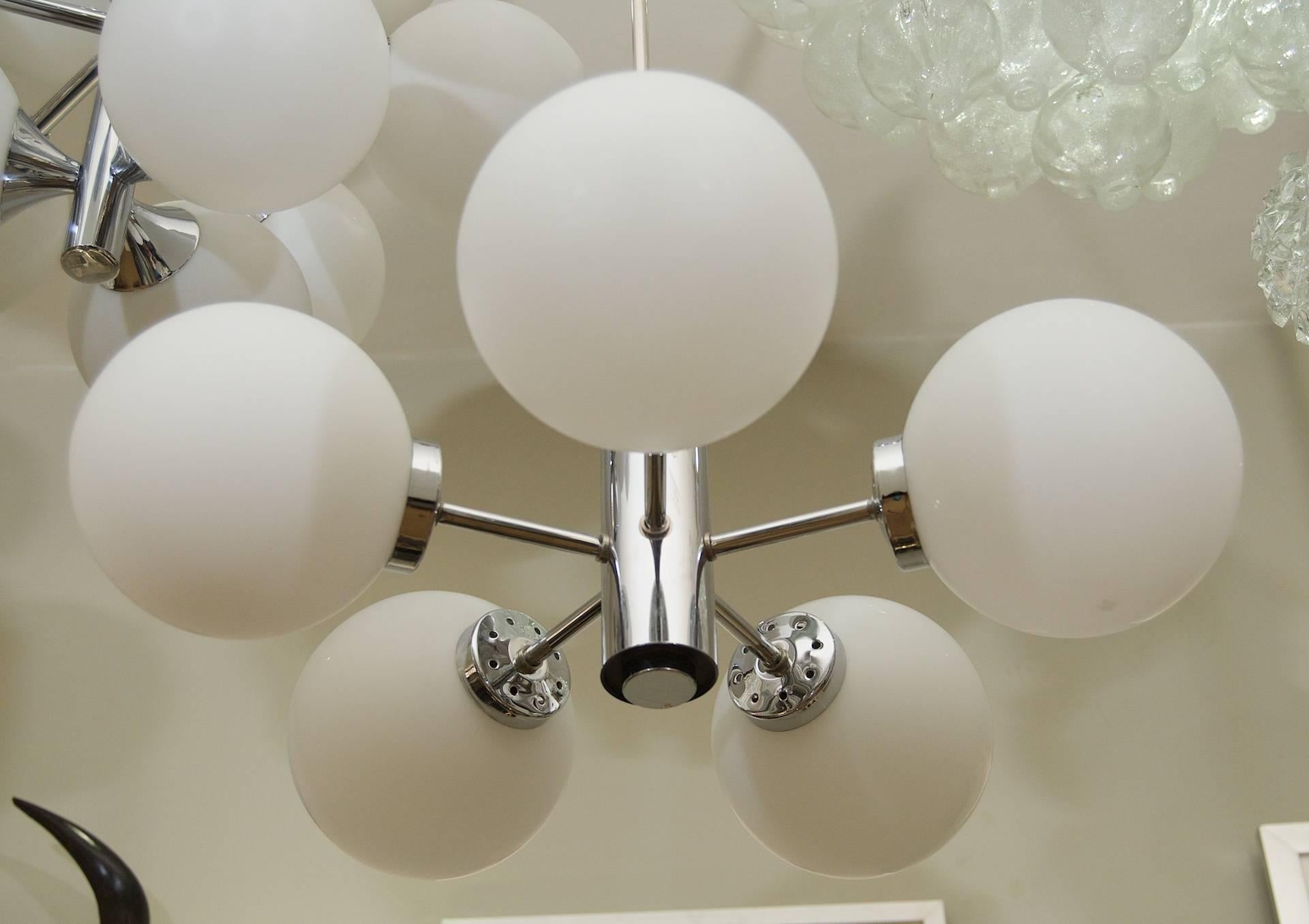 Five-armed chrome finish chandelier by Richard Essig with opal glass globes.

Takes 5 E-14 base bulbs up to 40 watts per bulb, new wiring.

Height listed is of chandelier body only; height as hung is 20
