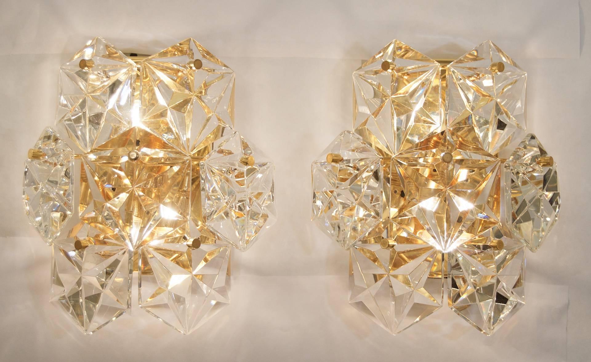 A spectacular pair of Kinkeldey wall sconces with seven crystals each, throwing an excellent, lustrous, fire. Back plates are gold-plated.

Each takes two E-14 bulbs up to 40W per socket. Completely rewired.

Please note price listed is per pair