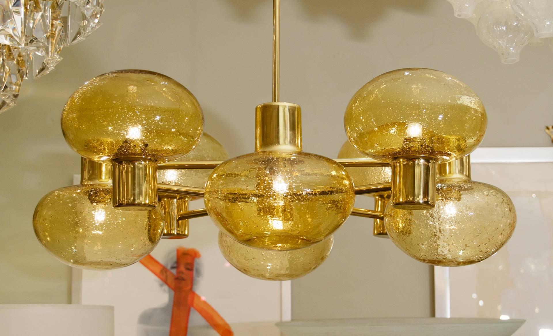 Mid-Century Modern Eight-Arm Doria Brass Chandelier with Amber Glass Globes