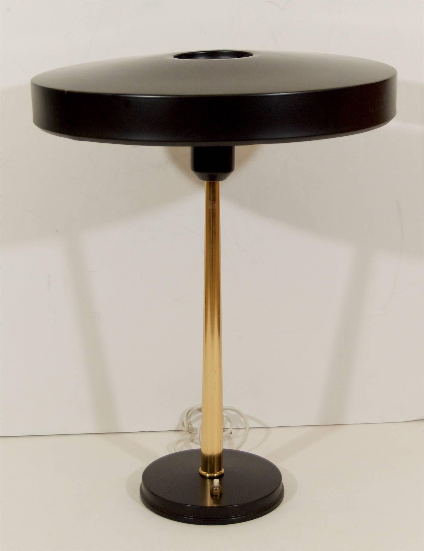 Mid-Century Modern lamp has a black lacquered steel shade and brass details. Louis Kalff designed the lamps for Philips in the 1950s.

Louis Kalff was a pioneering industrial designer in the Netherlands during the first half of the 20th century.