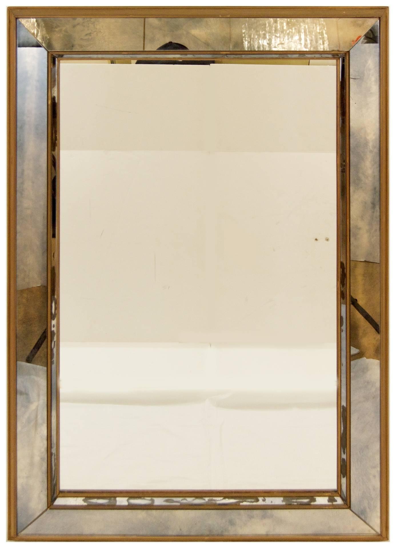 Vintage pair of mirrors, the central mirror bordered by angular antiqued mirror panels in a giltwood frame.

Can be hung horizontally or vertically.

See condition details; one narrow strip of mirror has been replaced, one strip has minor