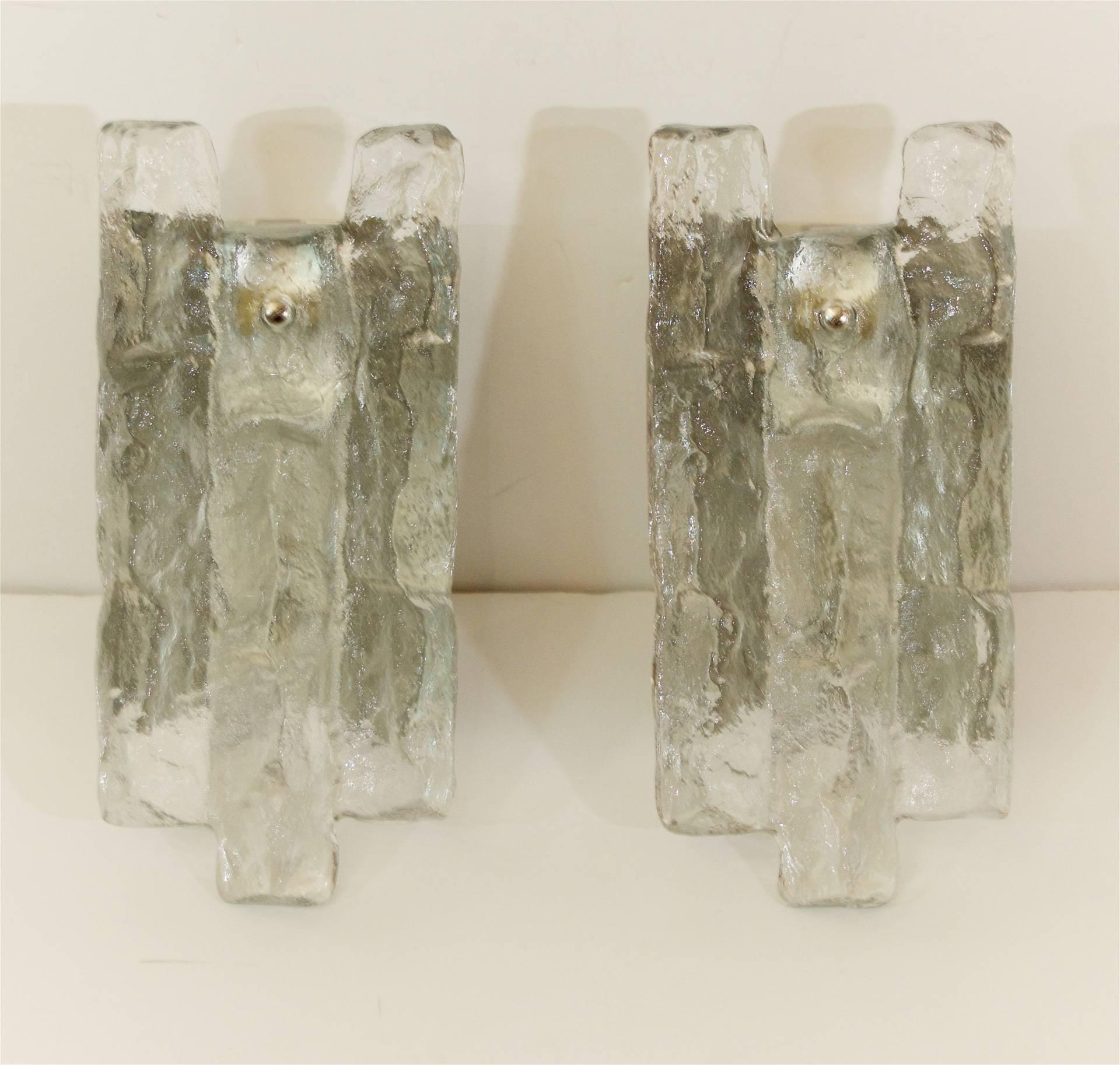 A pair of Kalmar sconces with a large single piece of ice glass on a nickel tone backplate. 

Takes one E-14 base bulb up to 40 watts per bulb. New wiring. 

Price listed is per pair.