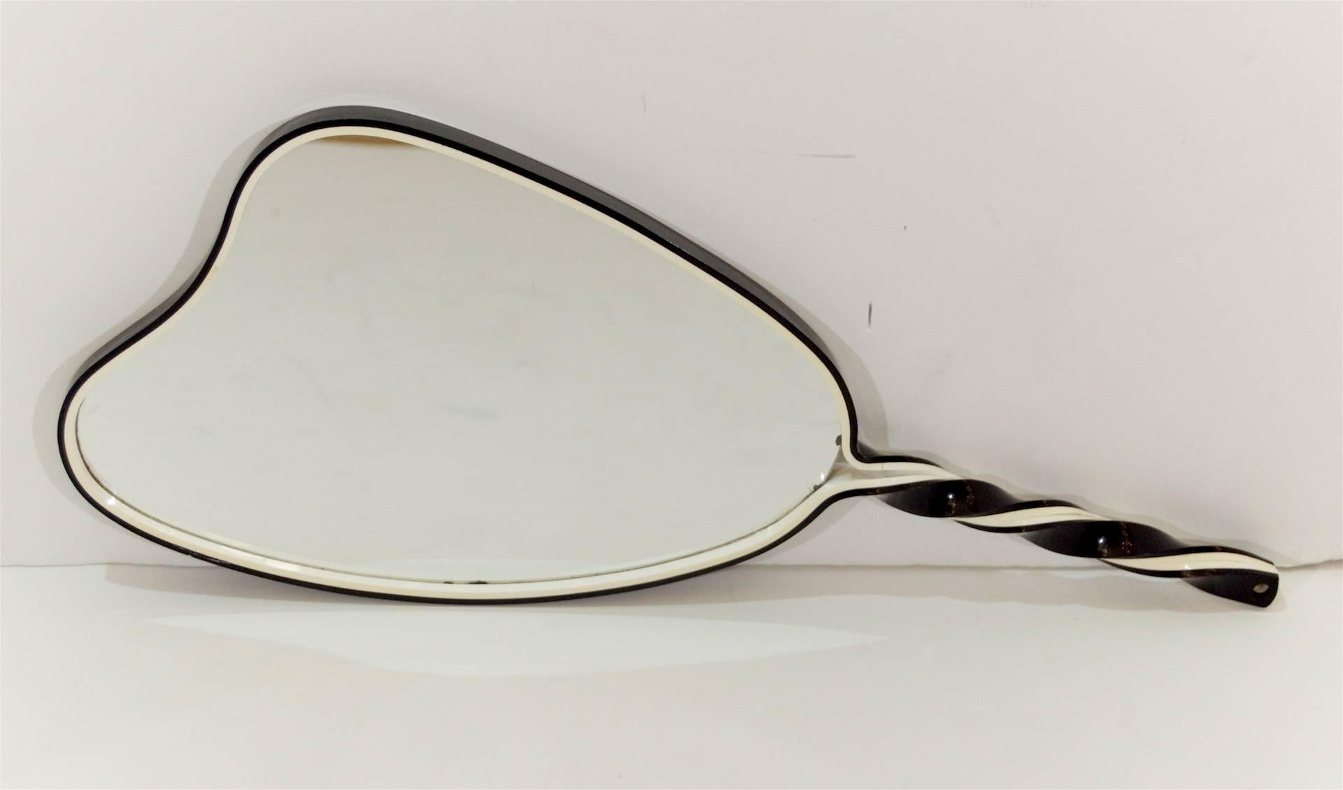 Beautifully formed black and white plexiglass mirror hand mirror, the layers of acrylic twisting to form the handle.