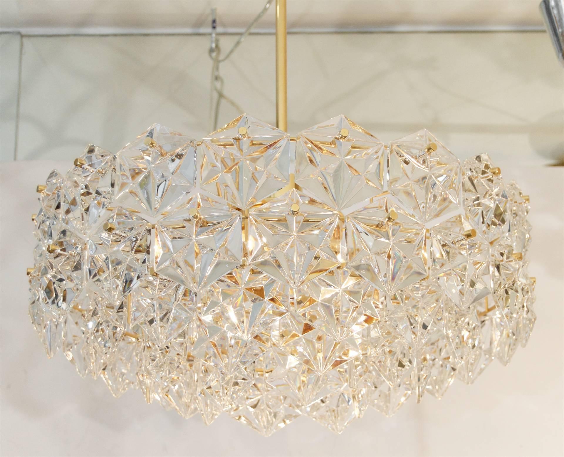 Elegant five-tier chandelier with faceted hexagonal crystals and a gold-plated chandelier body.

Take six E-14 base bulbs radially from the body (up to 40 watts each) and one medium base downlight (up to 75 watts.)

Height listed is of