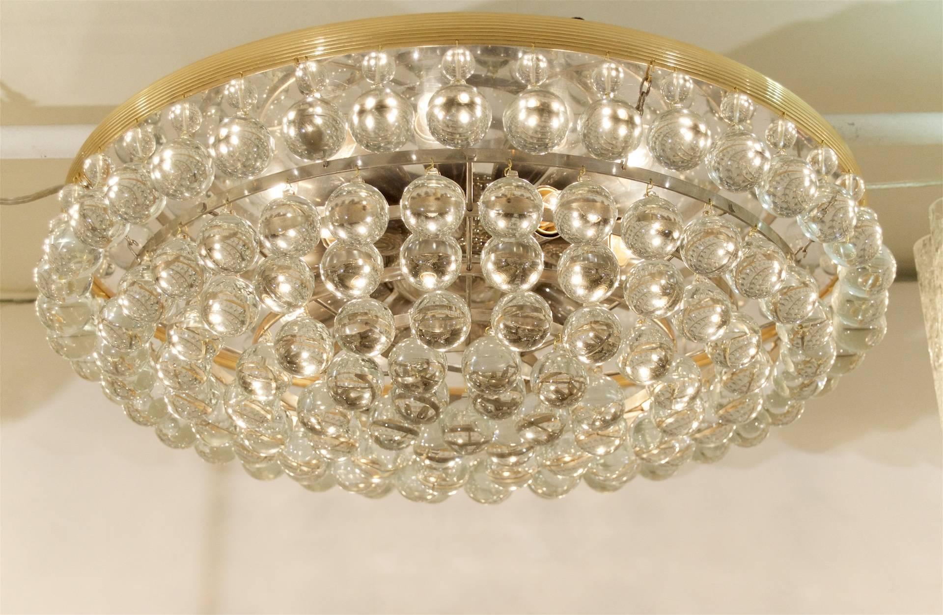 Elegant fixture, with 138 blown lead crystal balls suspended from individual wires. Gold-plated and metal finish will complement all decors. 

Takes 10 E-14 base bulbs up to 40 watts per bulb.