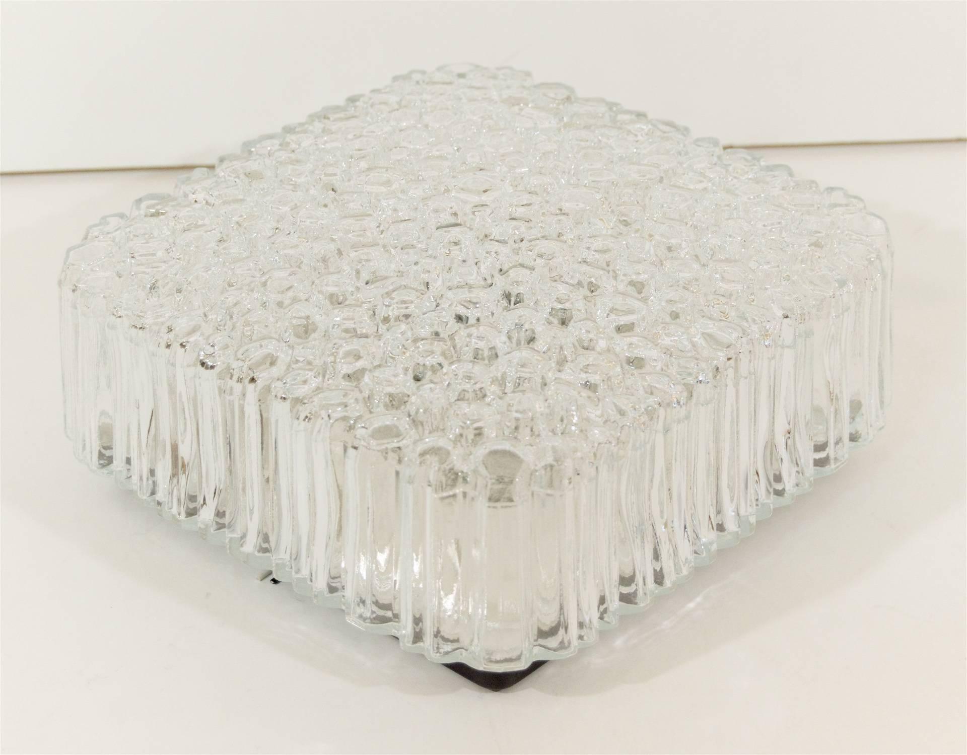 Beautiful glass flush mount has a raised etched glass bubble pattern with singular cuts on the side to create a linear pattern. 

Takes one medium base bulb up to 60 watts per bulb, new wiring.