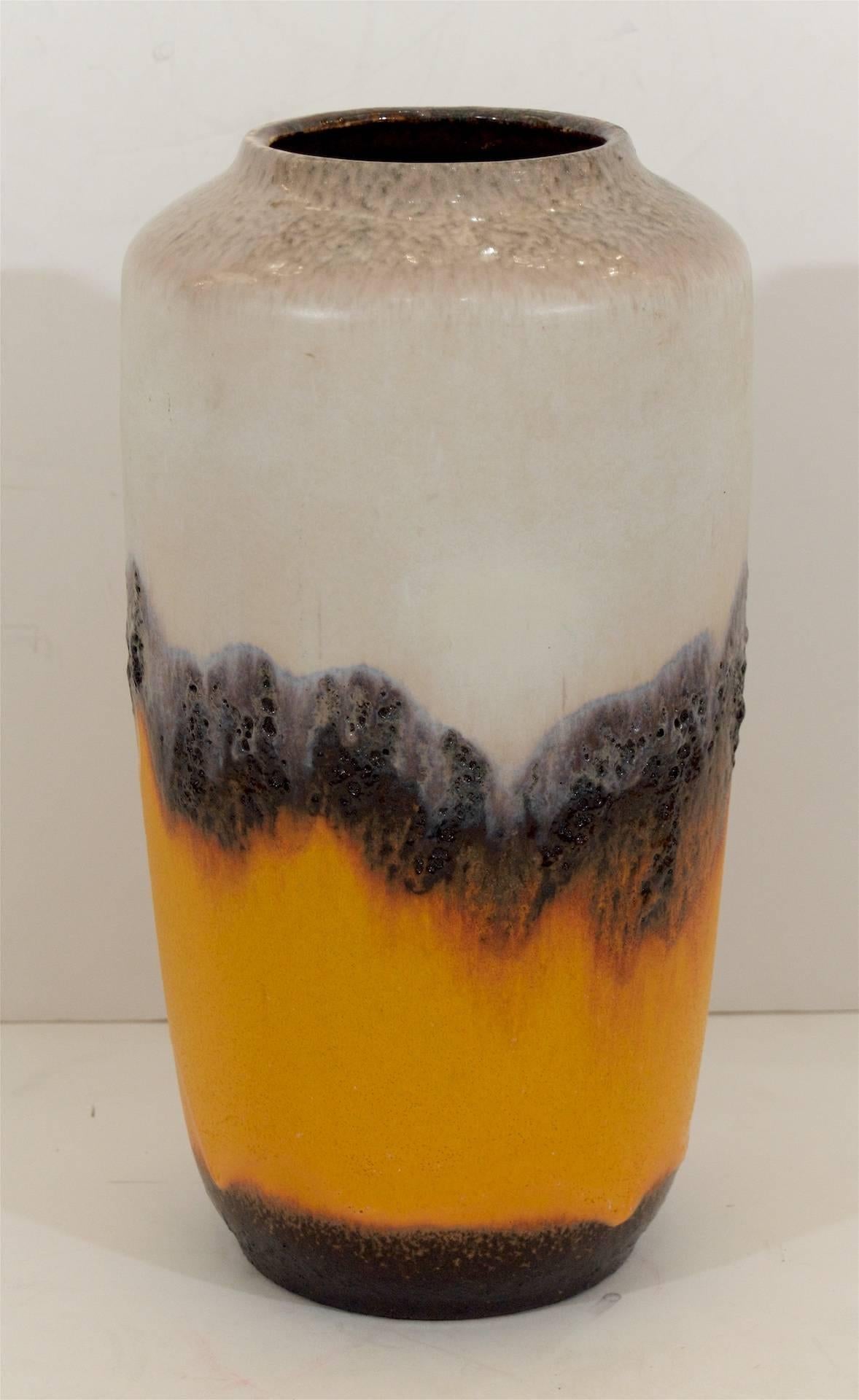 Highly dramatic Scheurich Keramik vase with an unusual gradient of glazes the lower half a fiery orange banded by matte textural lava glaze, the upper half in cooling opalescent tones.